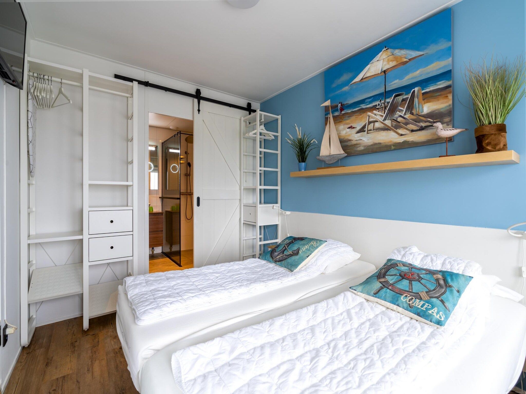 Een slaapkamer van Juliana 076 in De Koog