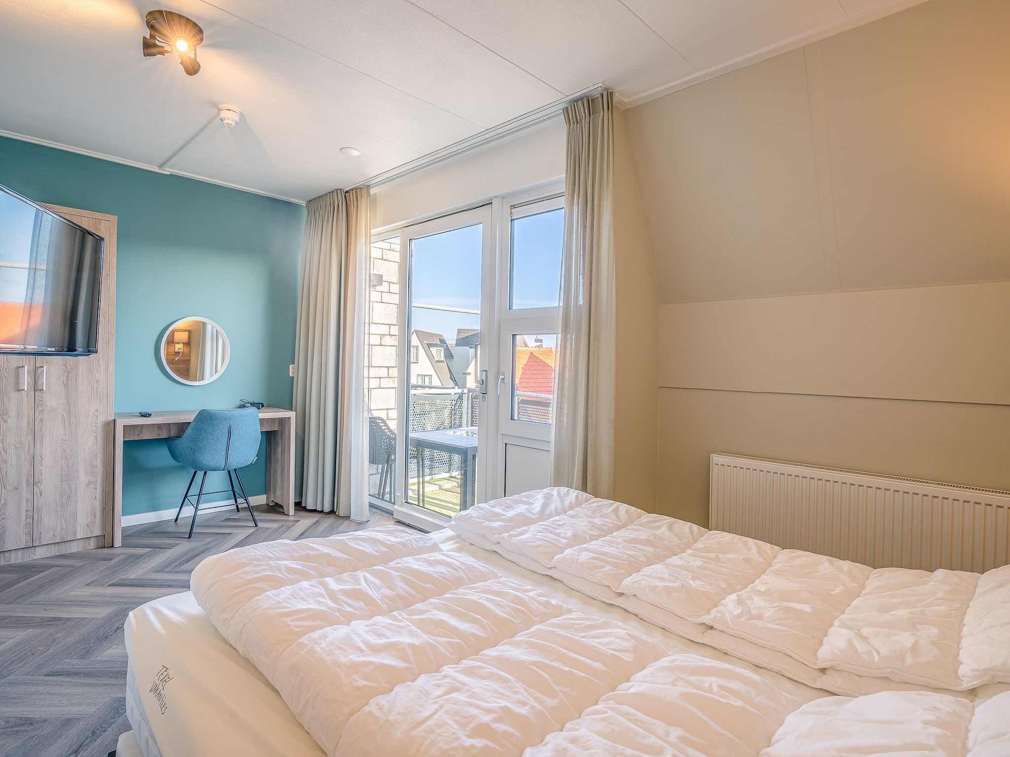 Een slaapkamer van Zeedistel 24 in De Koog