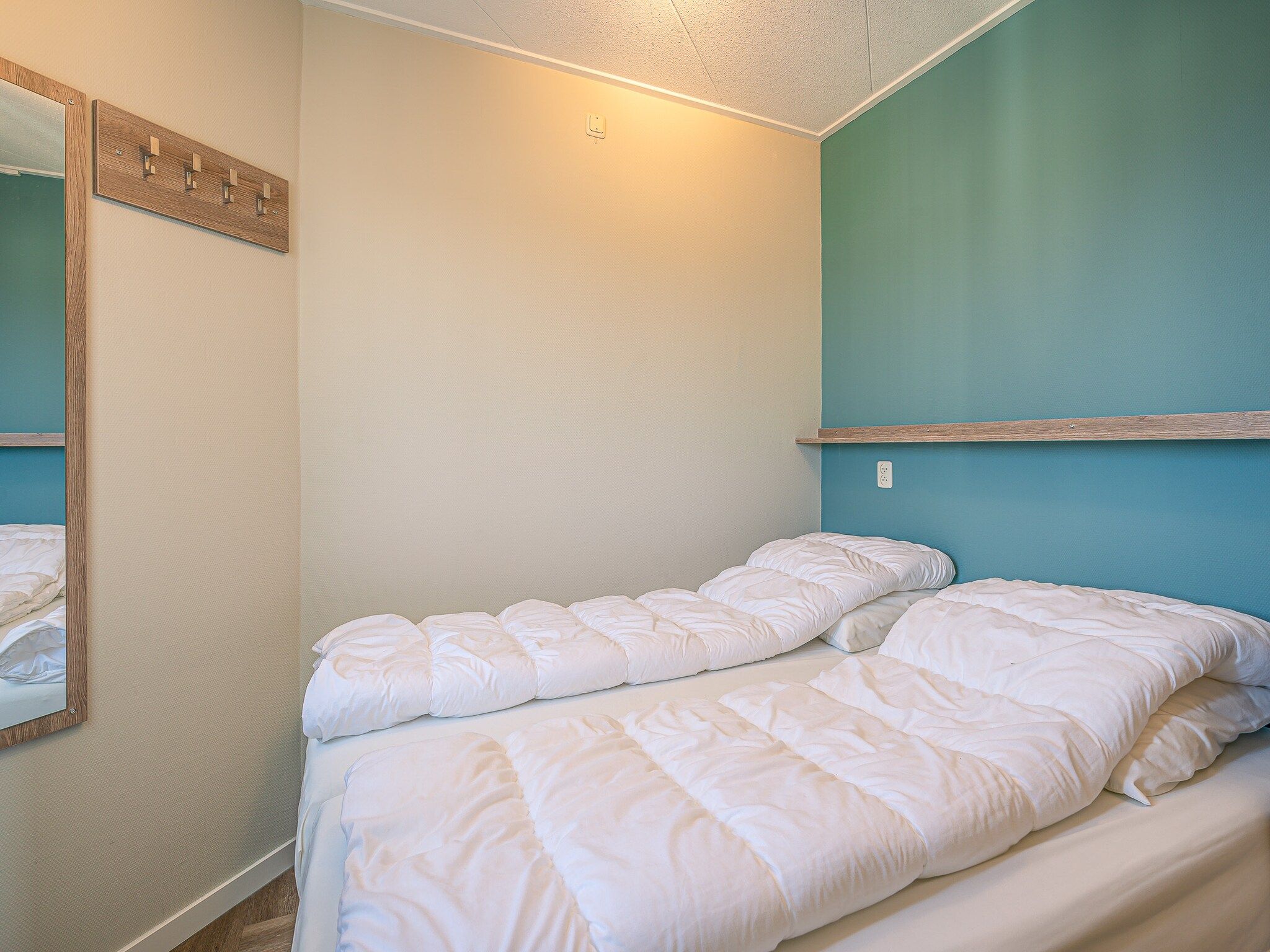 Een slaapkamer van Zeedistel 28 in De Koog