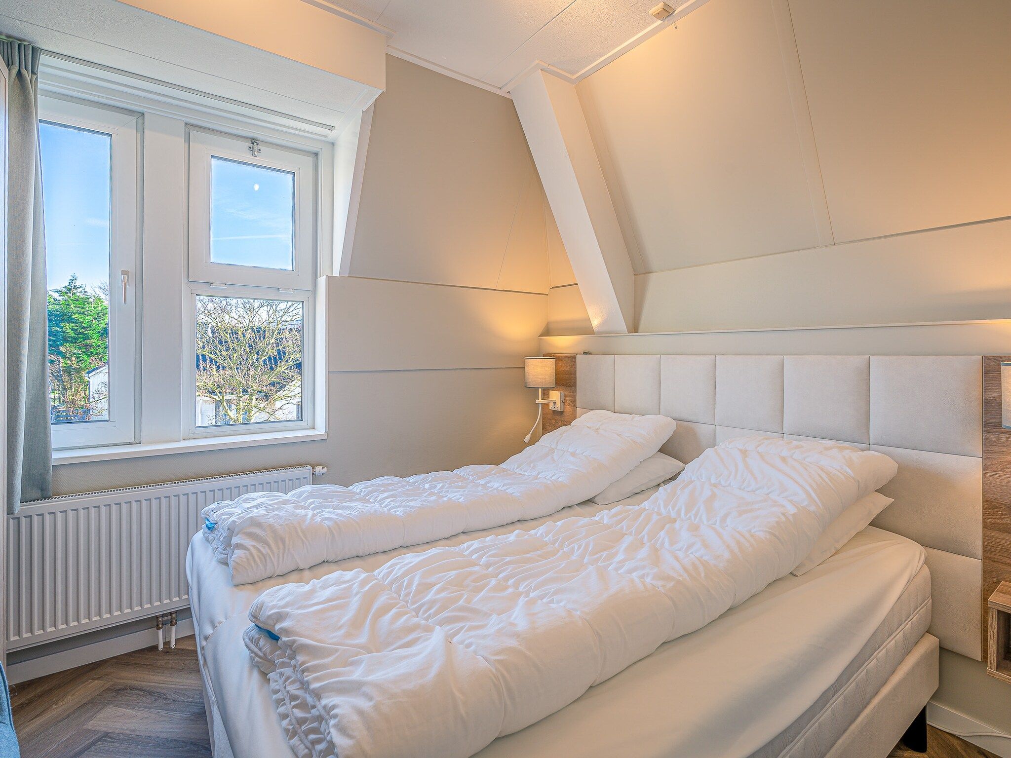 Een slaapkamer van Zeedistel 28 in De Koog