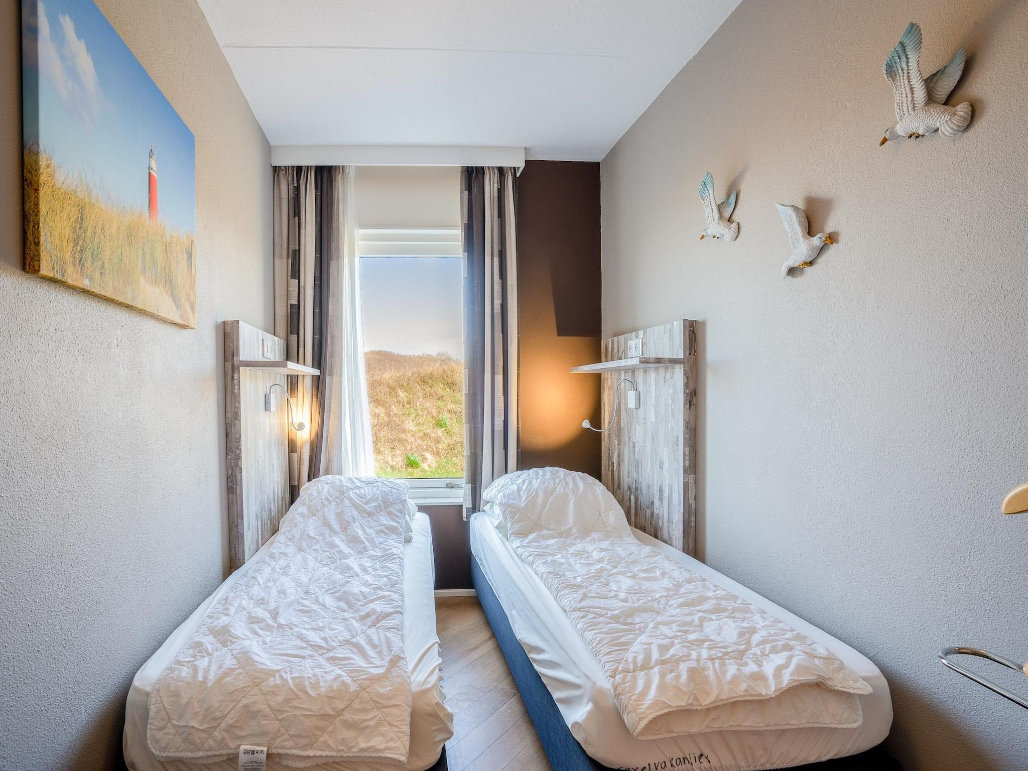 Een slaapkamer van Juliana 070 in De Koog