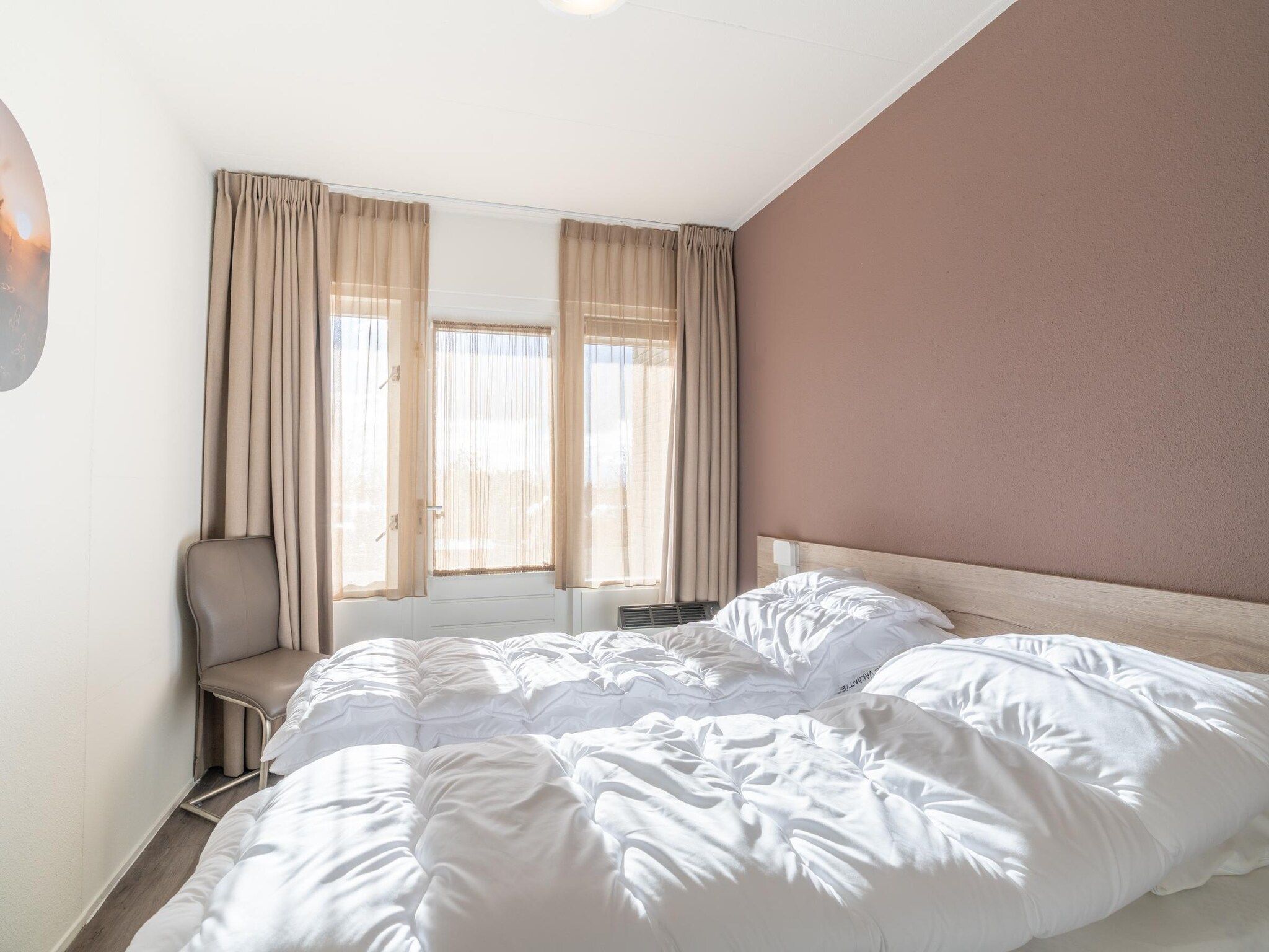 Een slaapkamer van Juliana 074 in De Koog