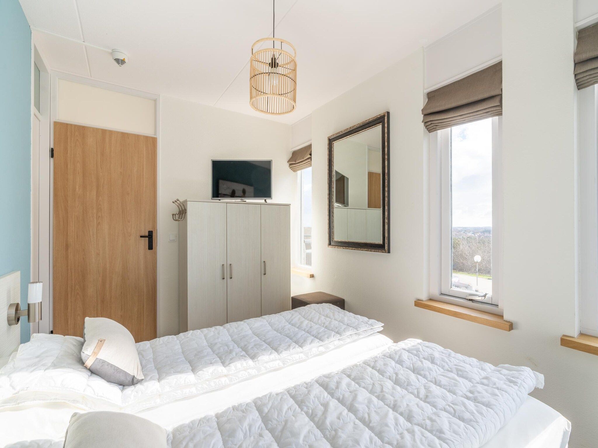 Een slaapkamer van Juliana 080 in De Koog