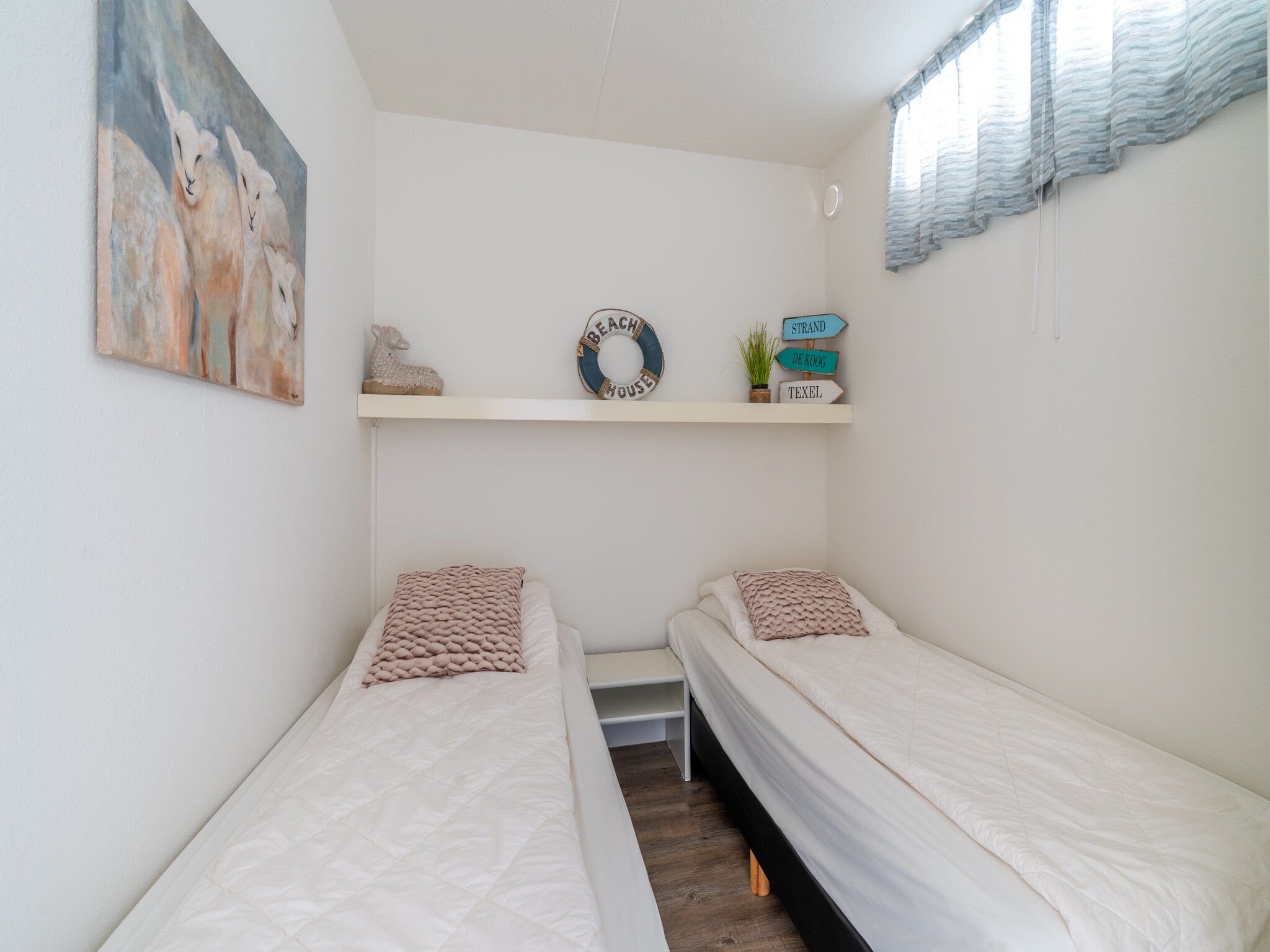 Een slaapkamer van Juliana 088 in De Koog