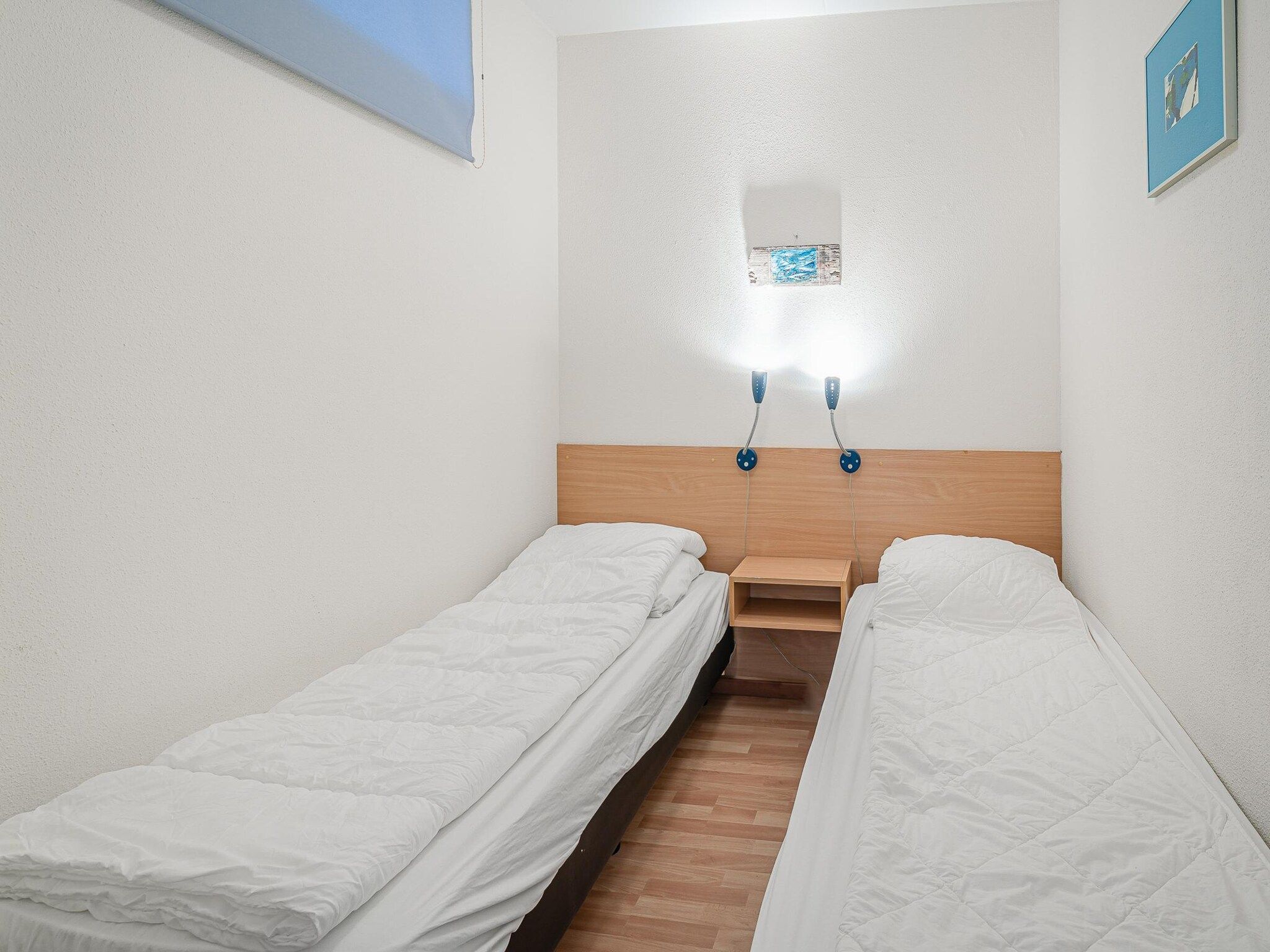 Een slaapkamer van Juliana 090 in De Koog