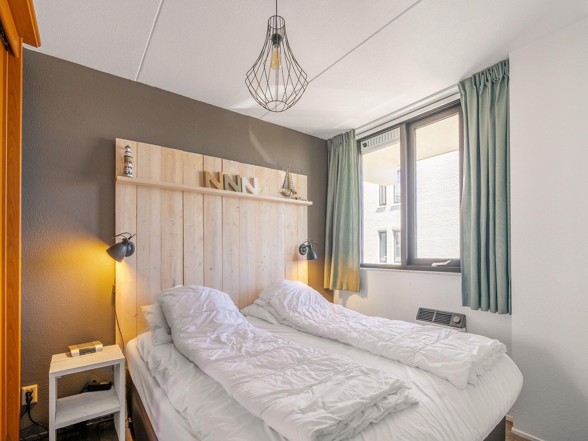 Een slaapkamer van Juliana 094 in De Koog