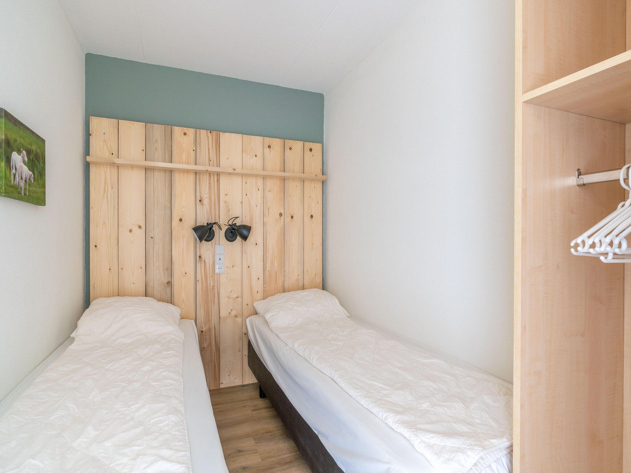 Een slaapkamer van Juliana 098 in De Koog