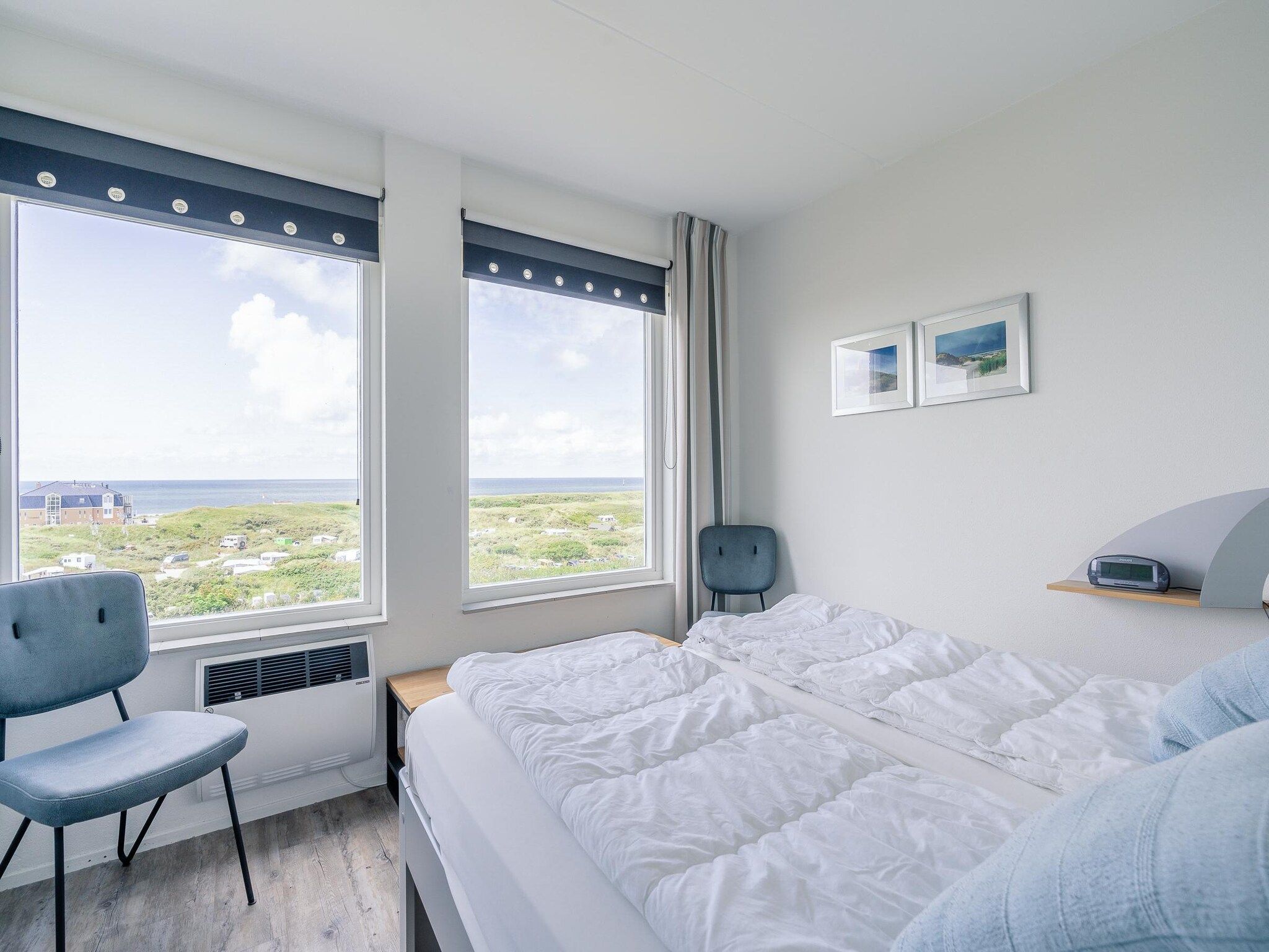 Een slaapkamer van Juliana 100 in De Koog