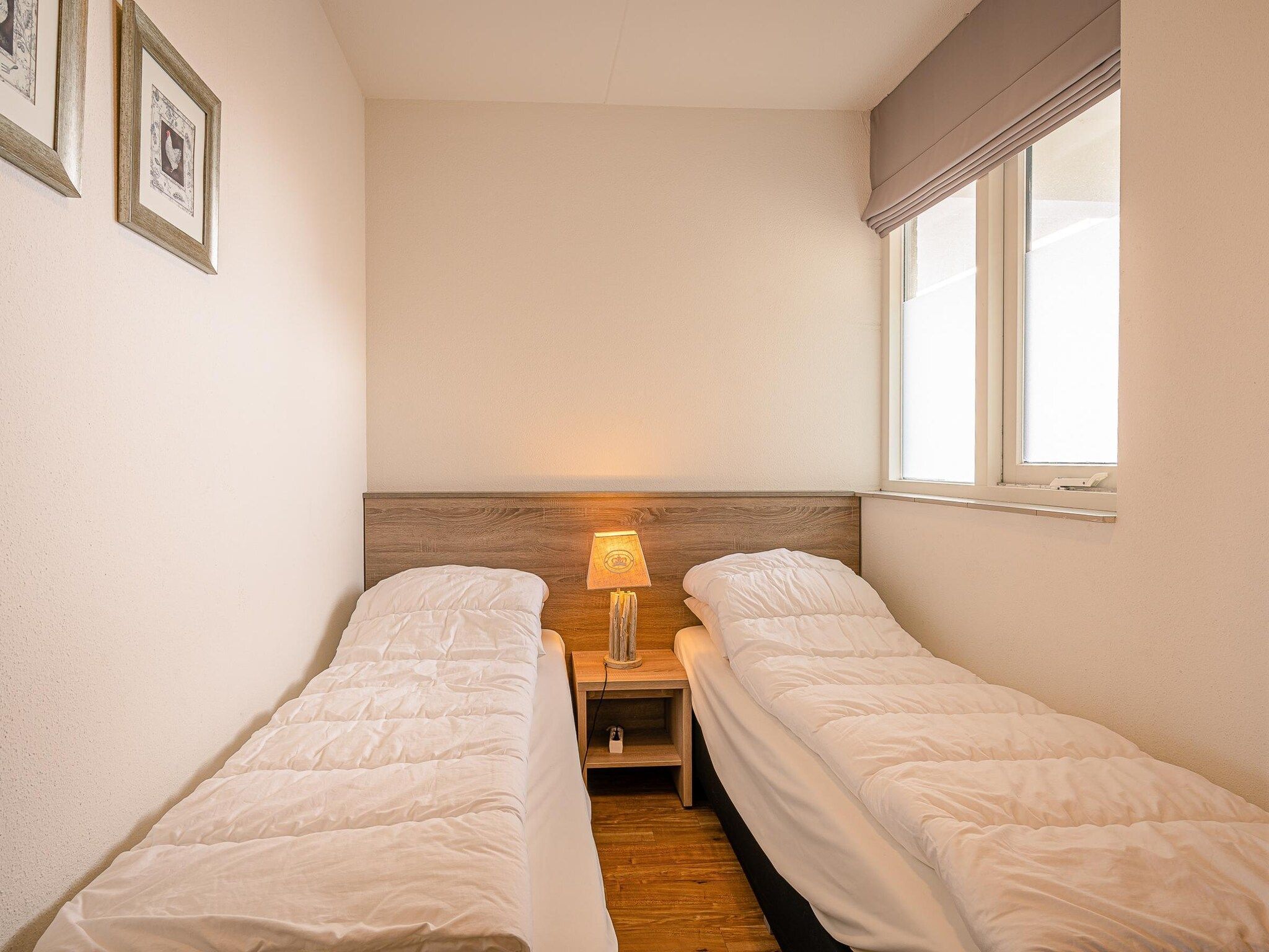 Een slaapkamer van Juliana 102 in De Koog