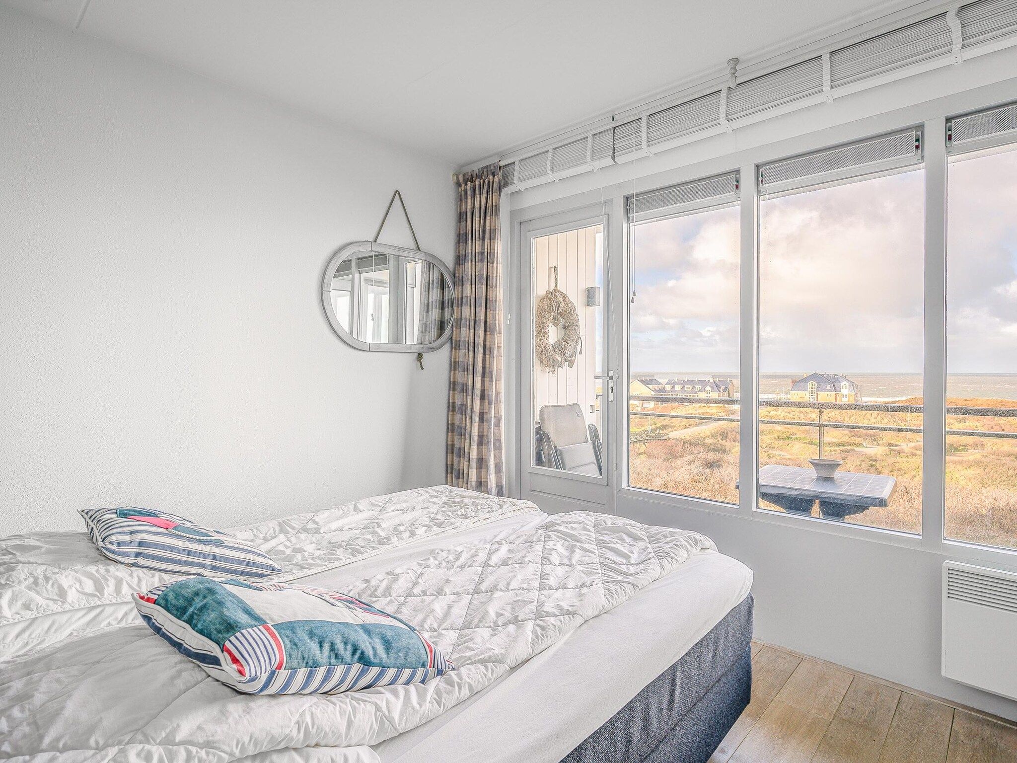 Een slaapkamer van Juliana 104 in De Koog