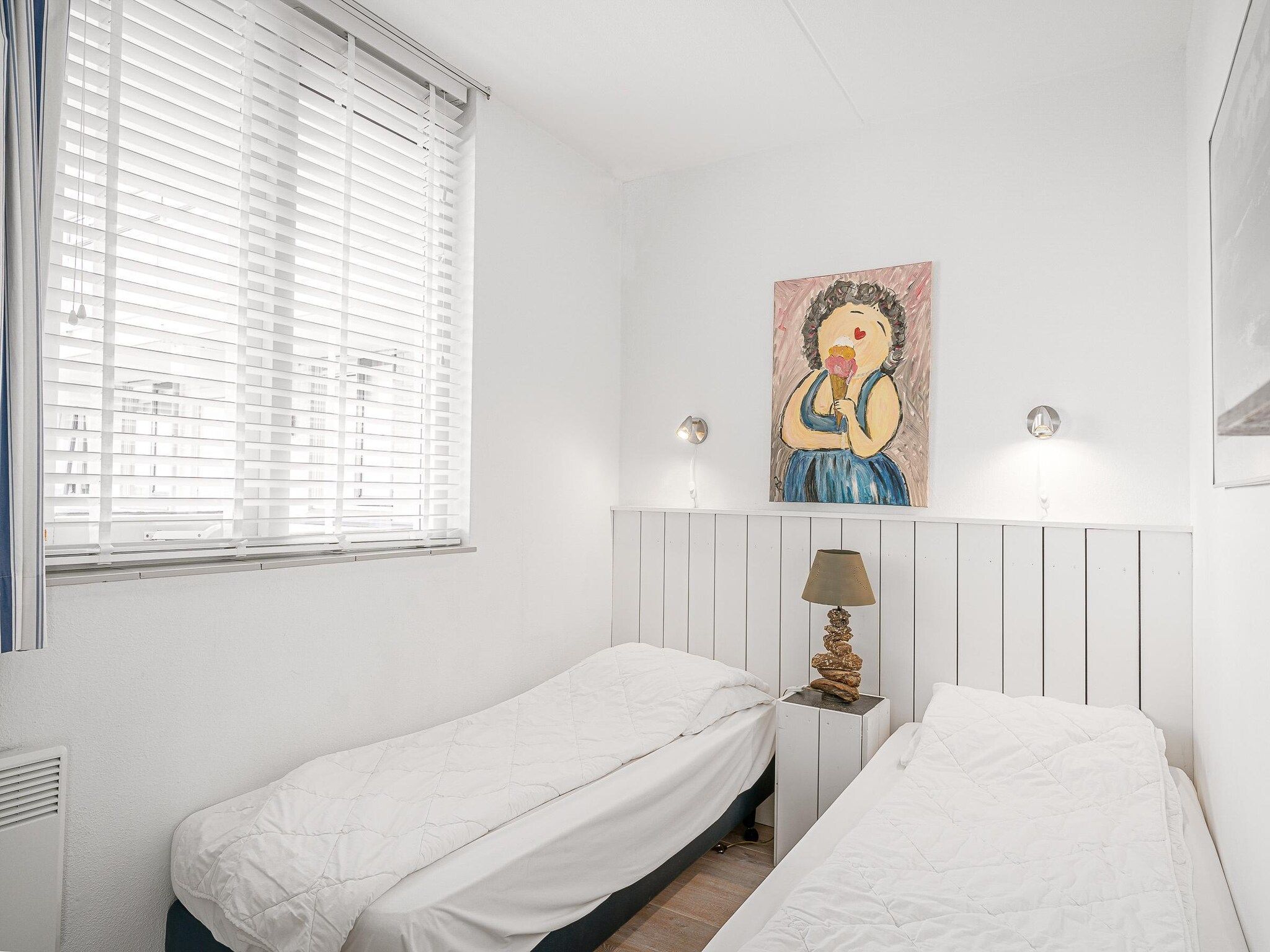 Een slaapkamer van Juliana 104 in De Koog