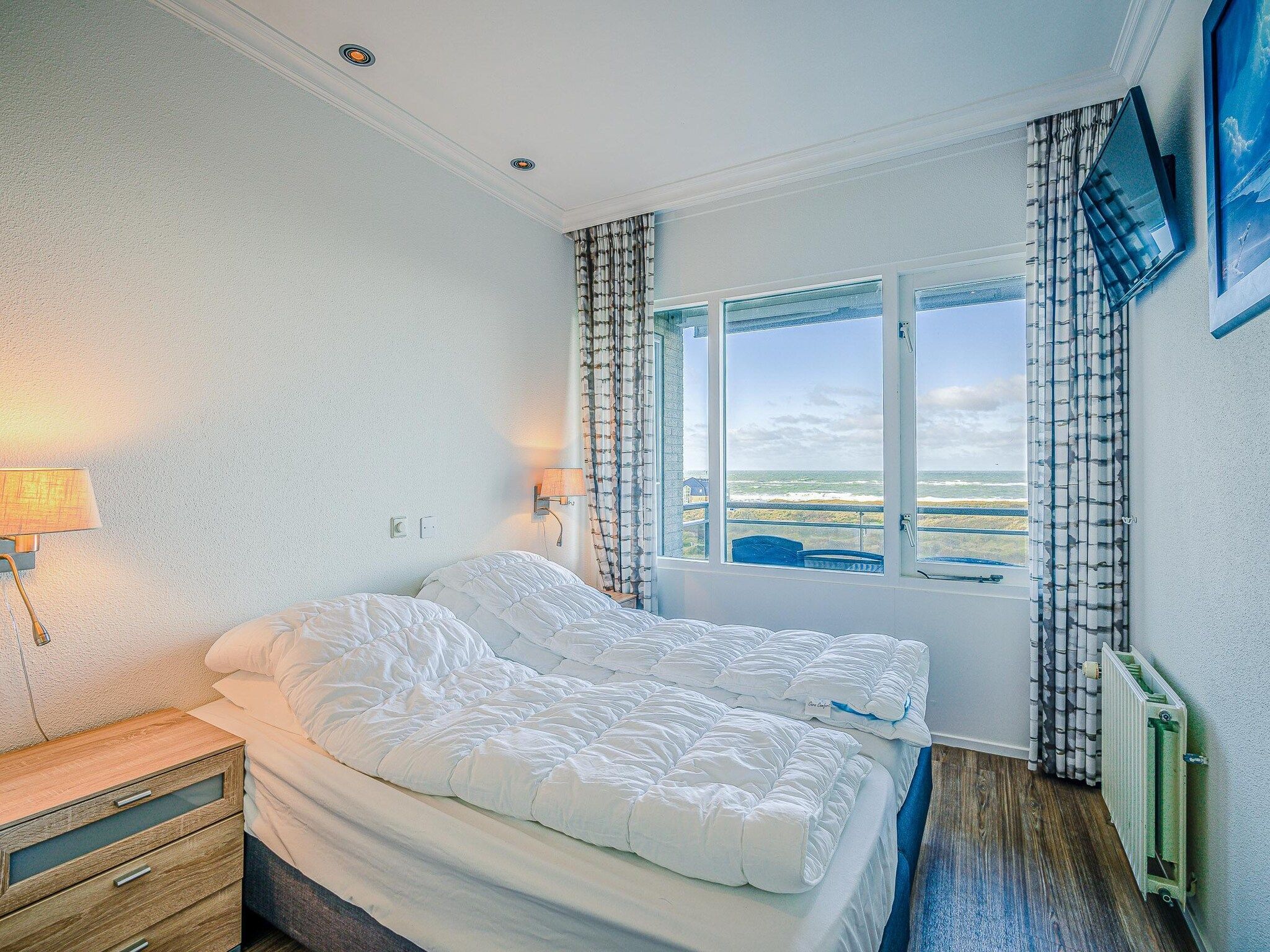 Een slaapkamer van Juliana 164 in De Koog