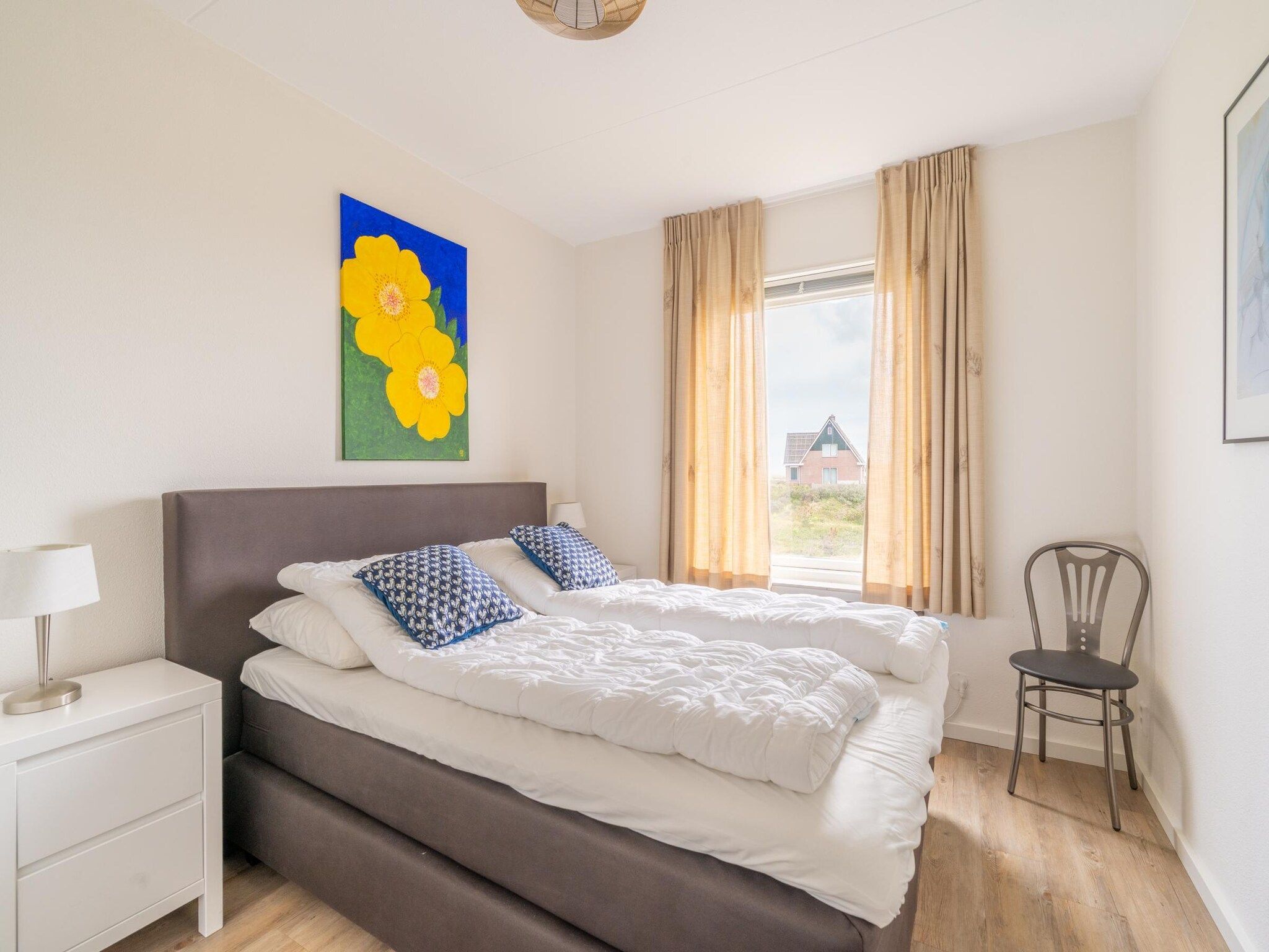 Een slaapkamer van Juliana 170 in De Koog