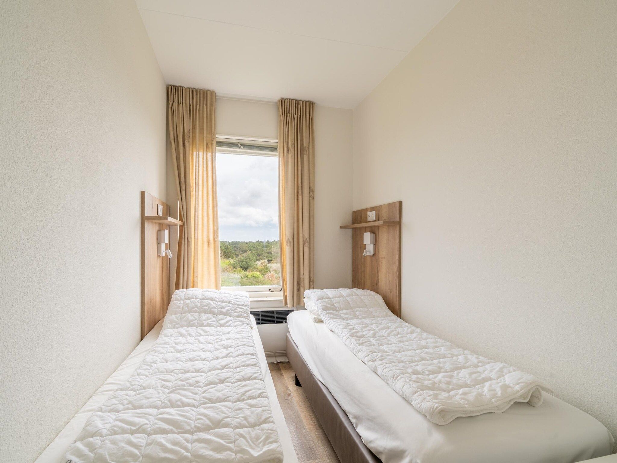 Een slaapkamer van Juliana 170 in De Koog