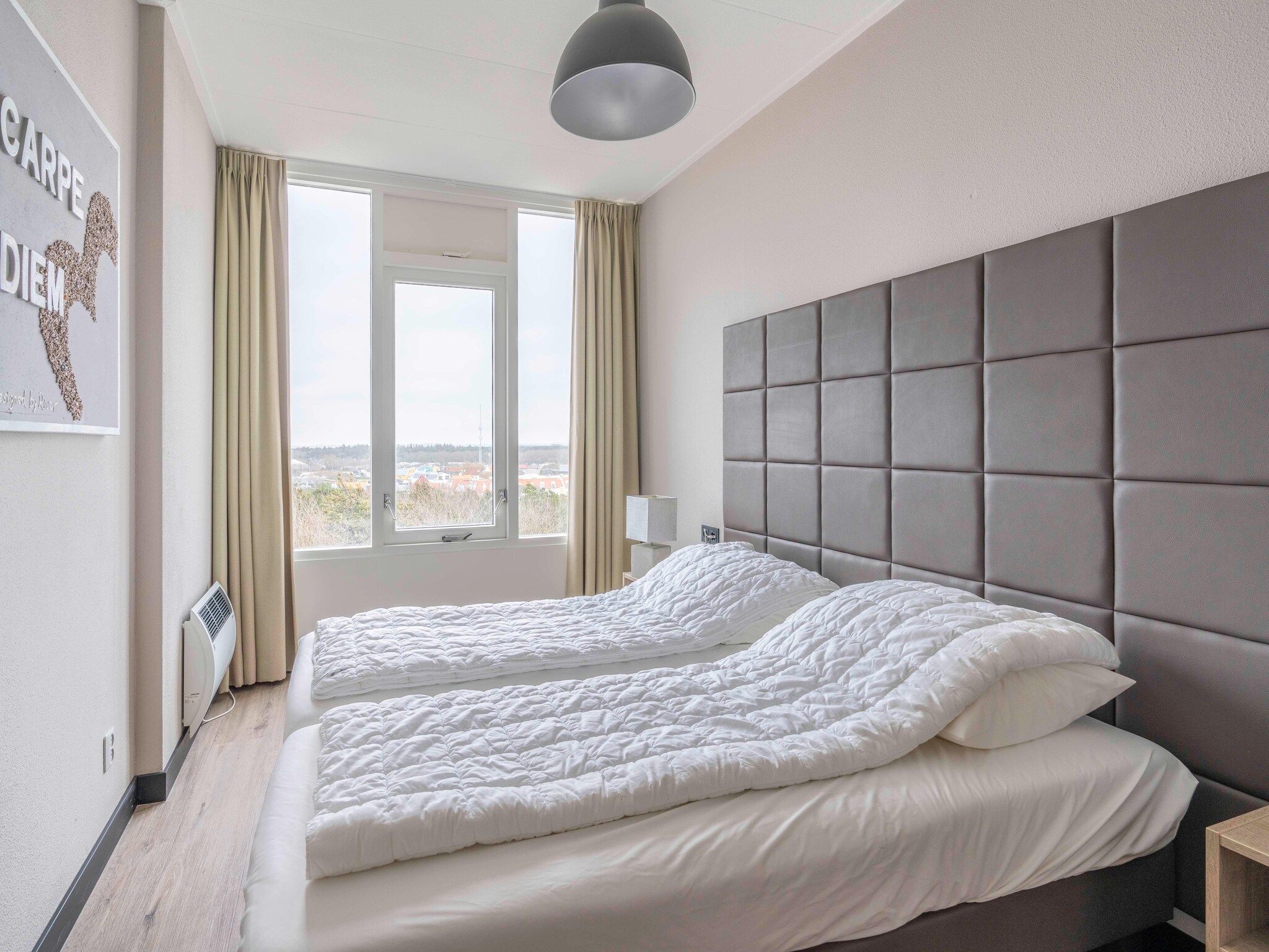 Een slaapkamer van Juliana 174 in De Koog