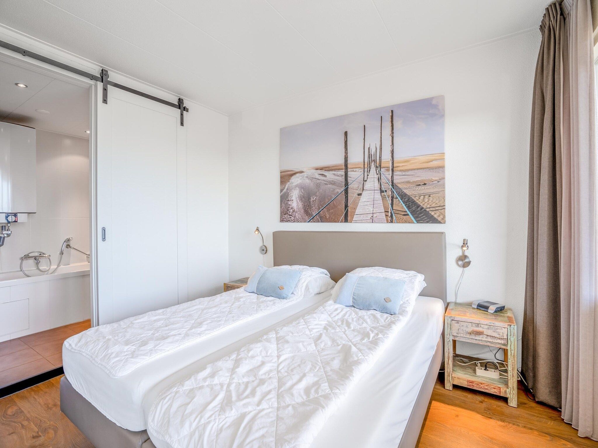 Een slaapkamer van Juliana 122 in De Koog