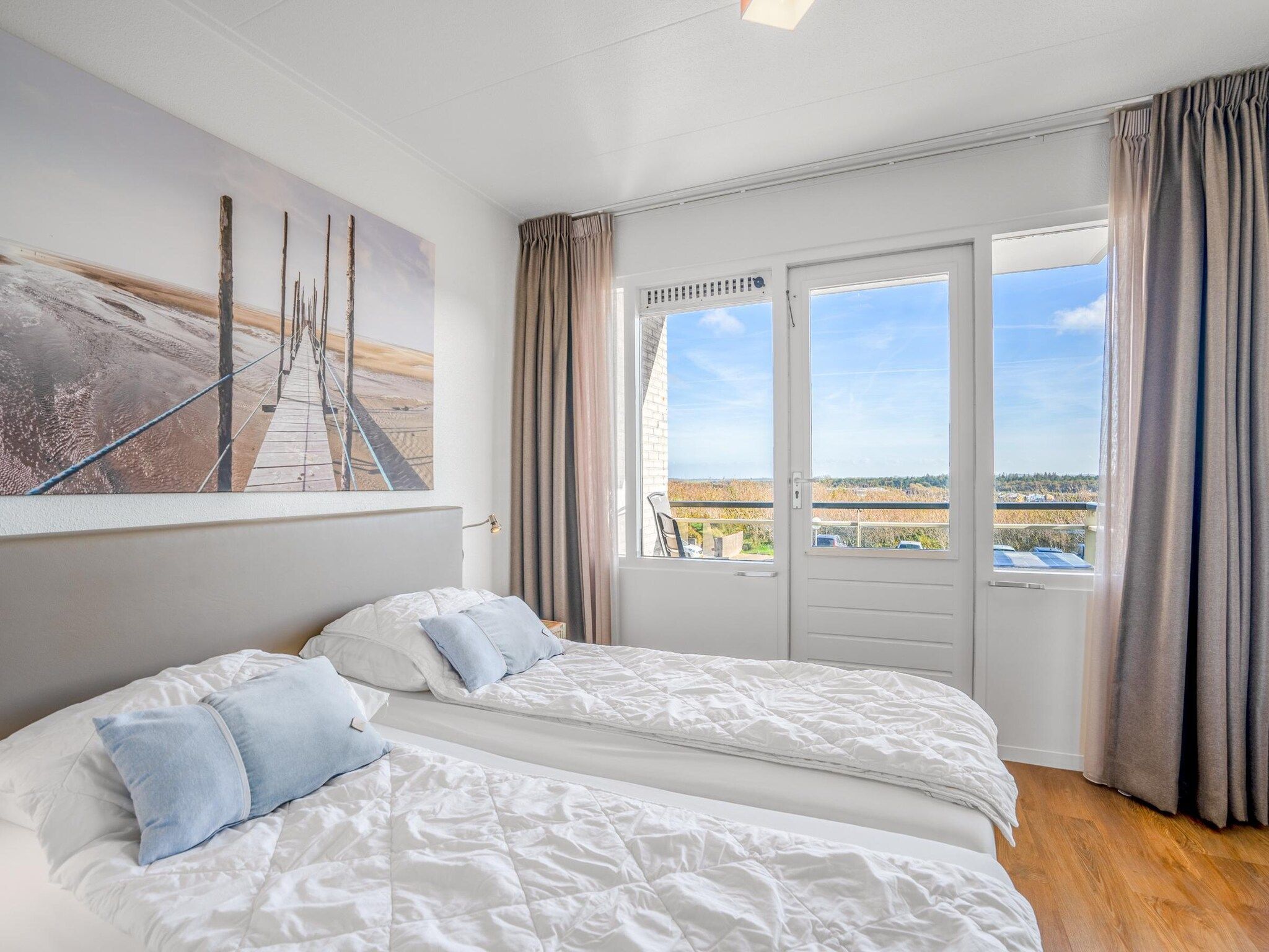 Een slaapkamer van Juliana 122 in De Koog