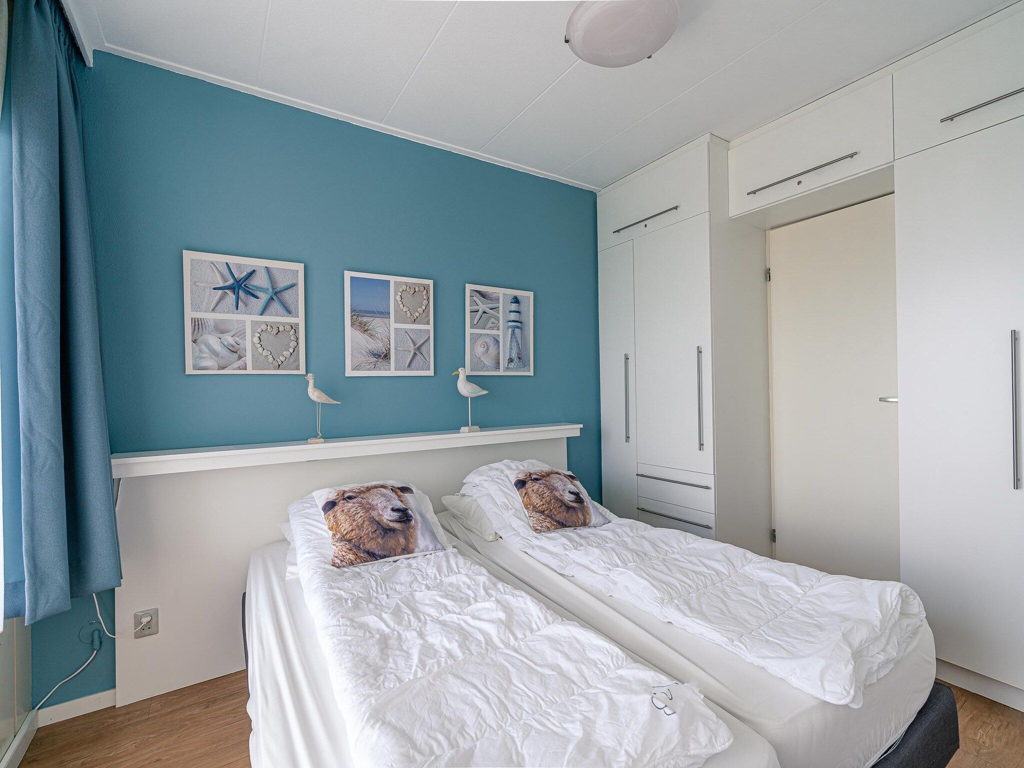 Een slaapkamer van Juliana 128 in De Koog