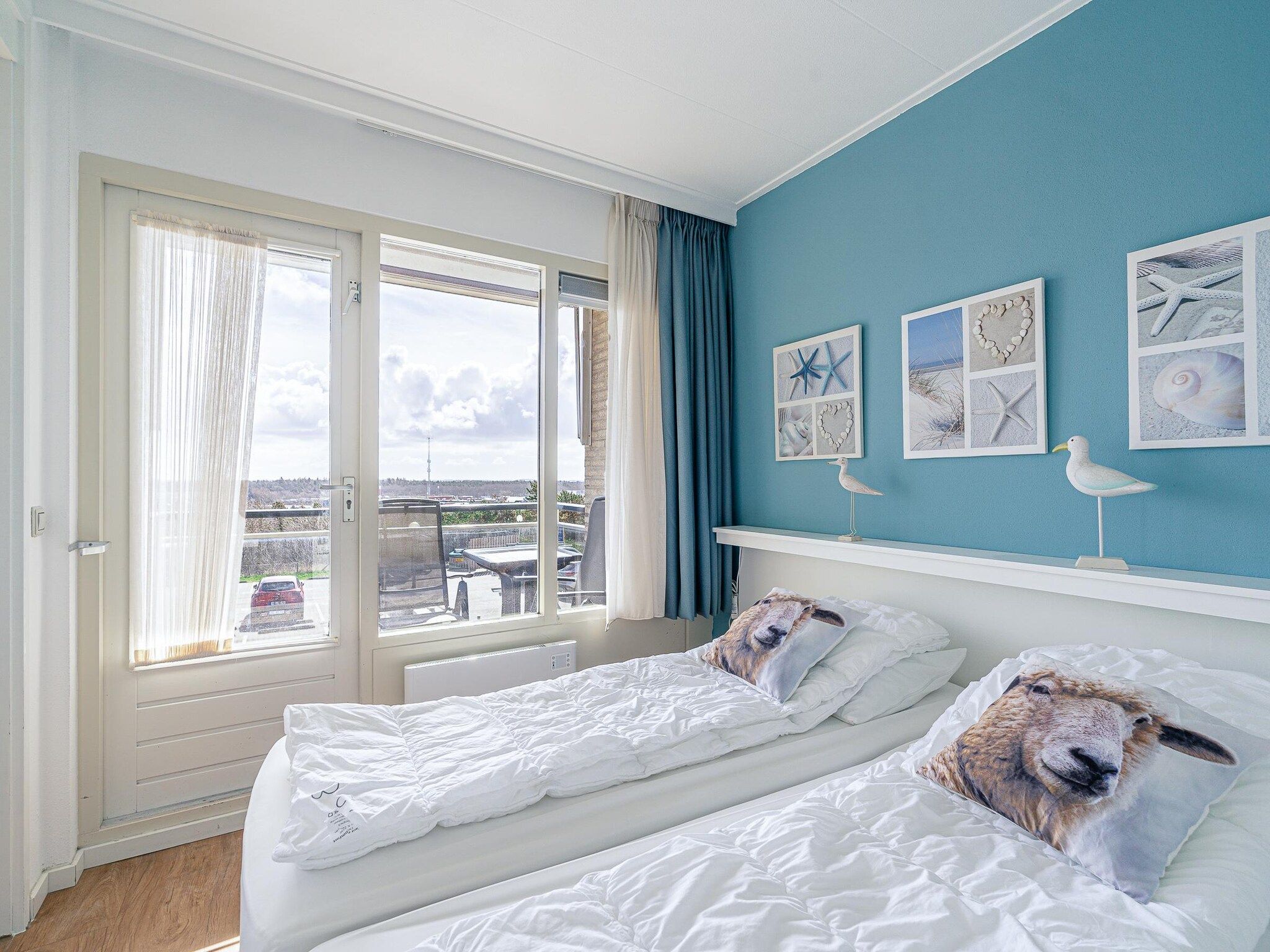 Een slaapkamer van Juliana 128 in De Koog