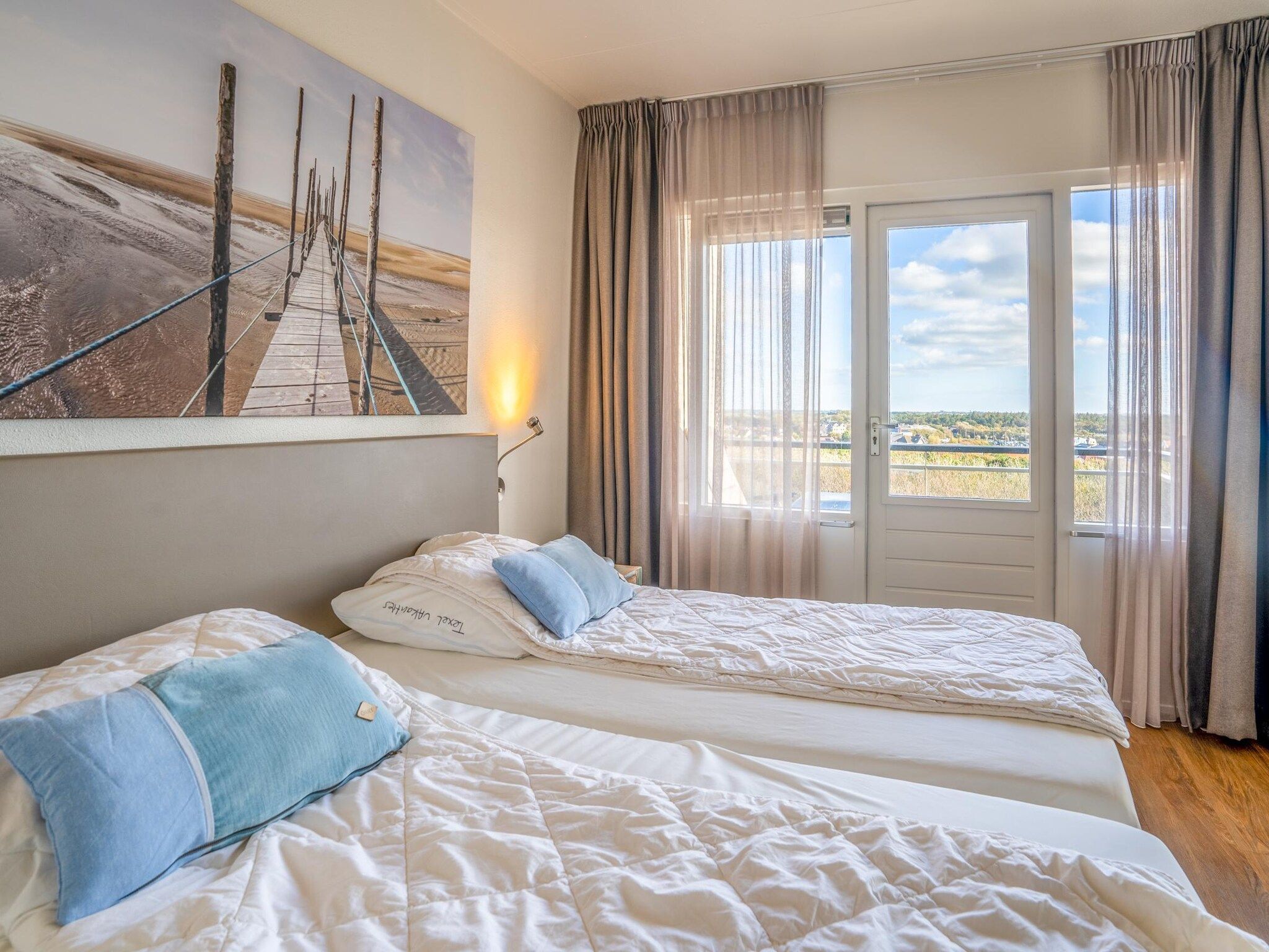 Een slaapkamer van Juliana 172 in De Koog