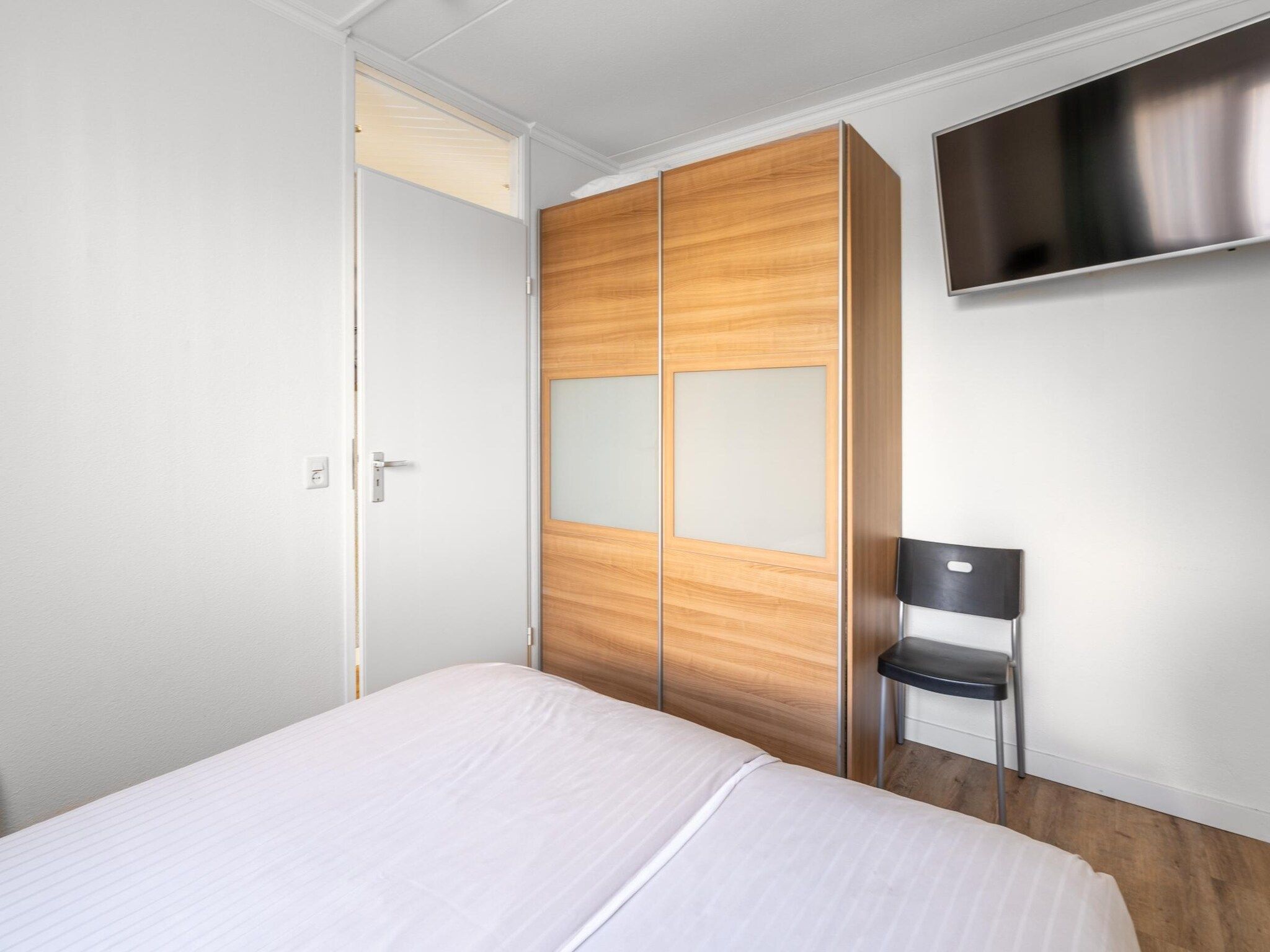 Een slaapkamer van Juliana 136 in De Koog