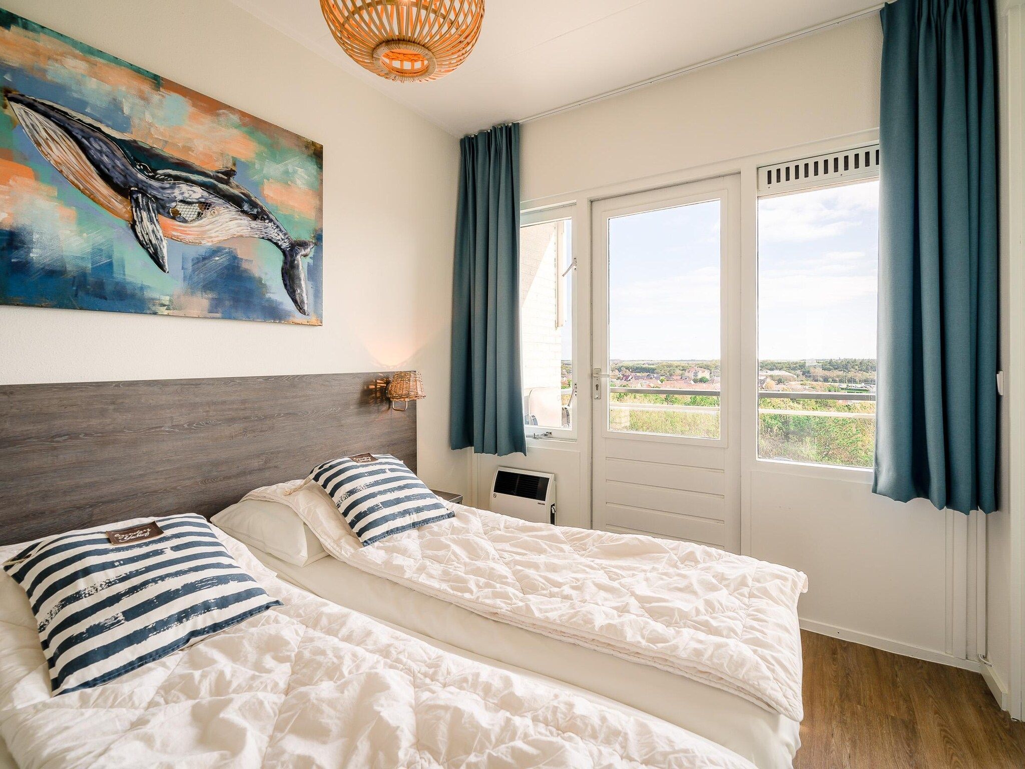 Een slaapkamer van Juliana 176 in De Koog