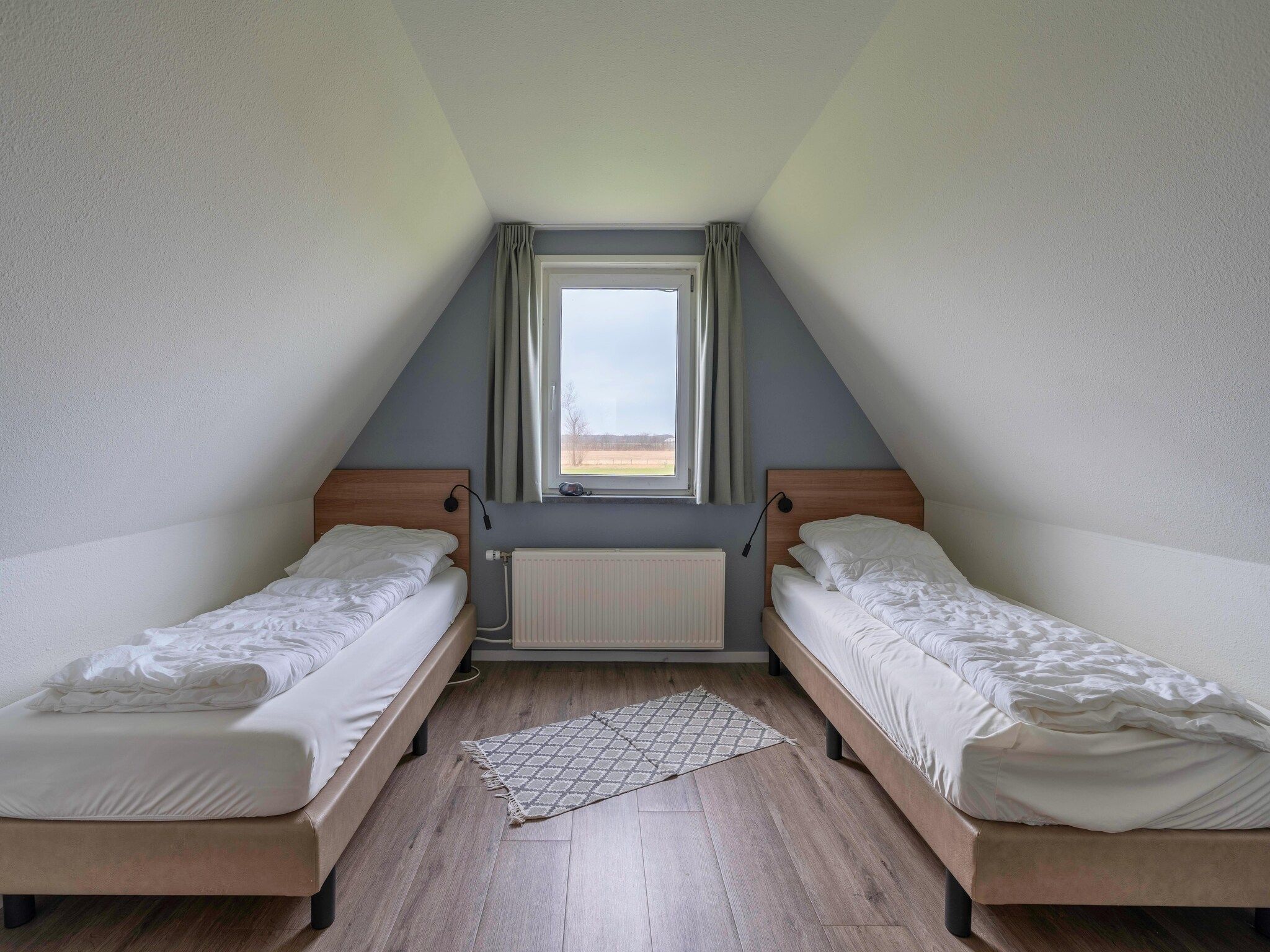 Een slaapkamer van Nieuwlanderweg 77 in De Waal