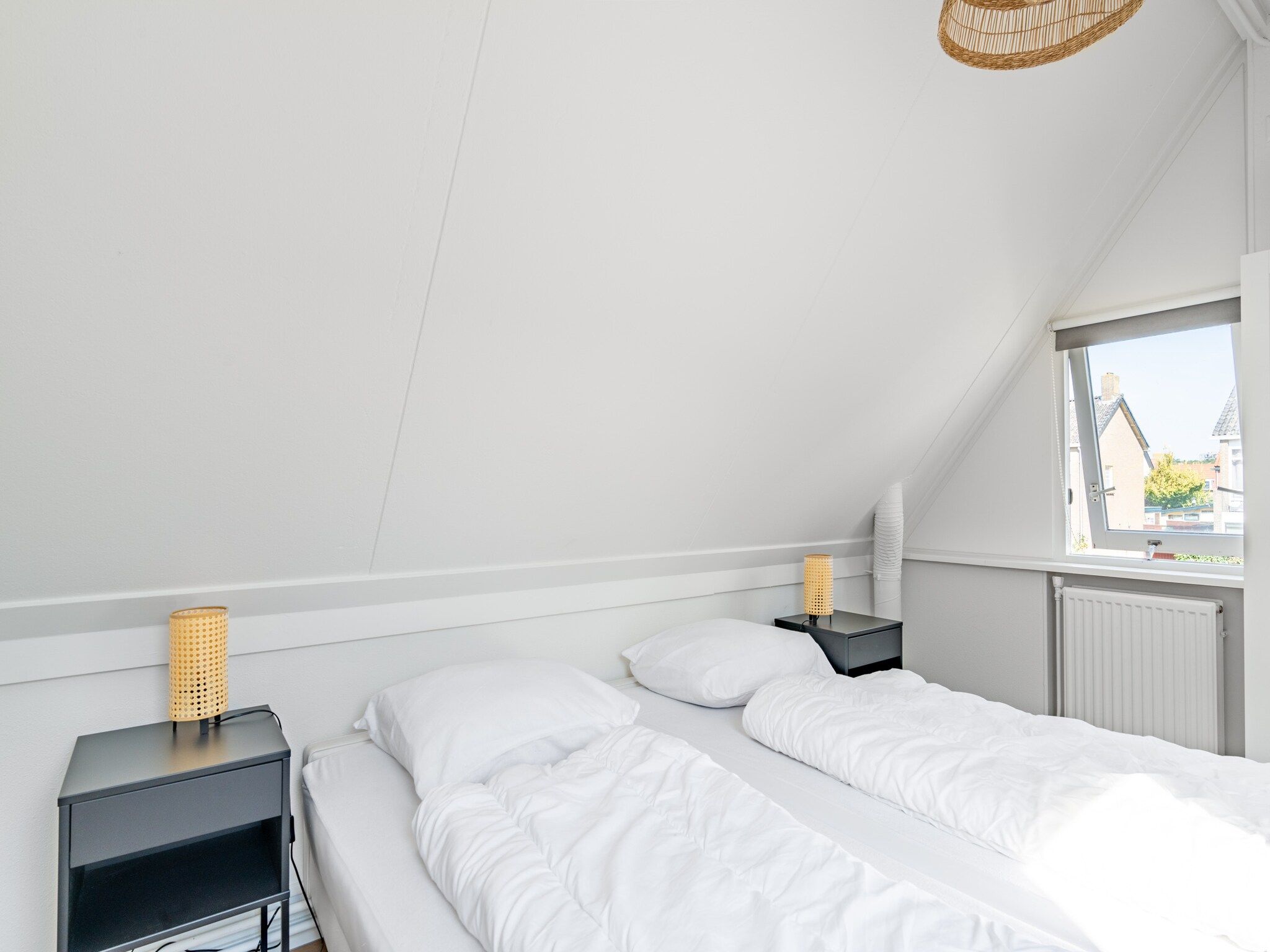 Een slaapkamer van Plevierstraat 3A in De Koog