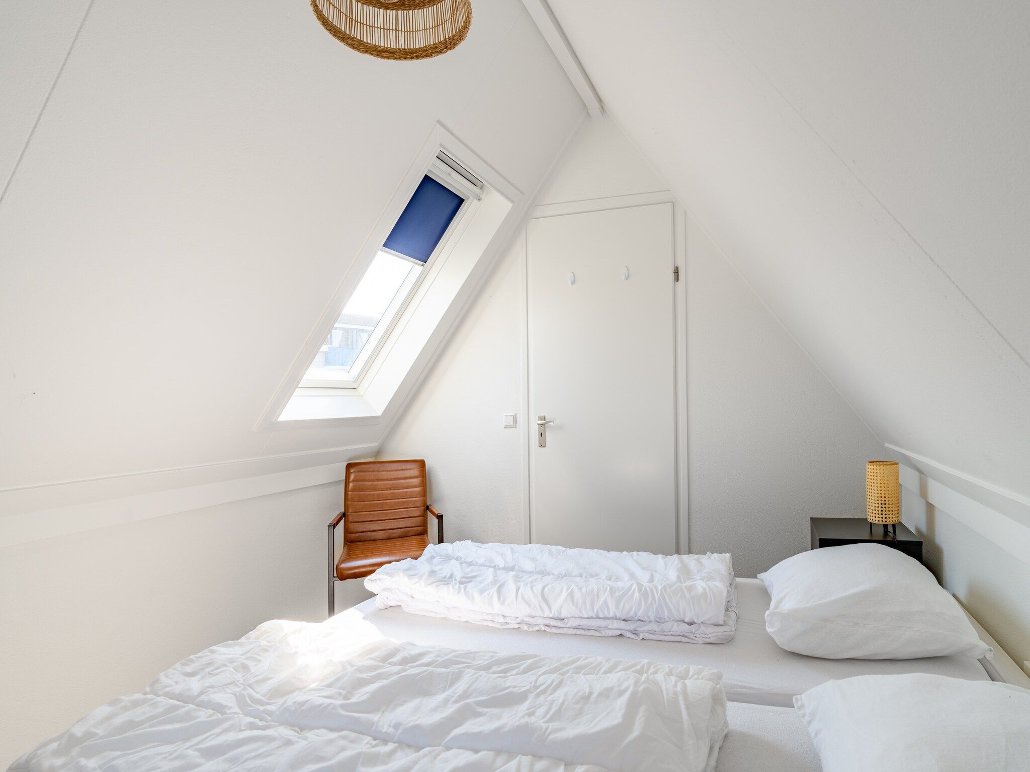 Een slaapkamer van Plevierstraat 3A in De Koog