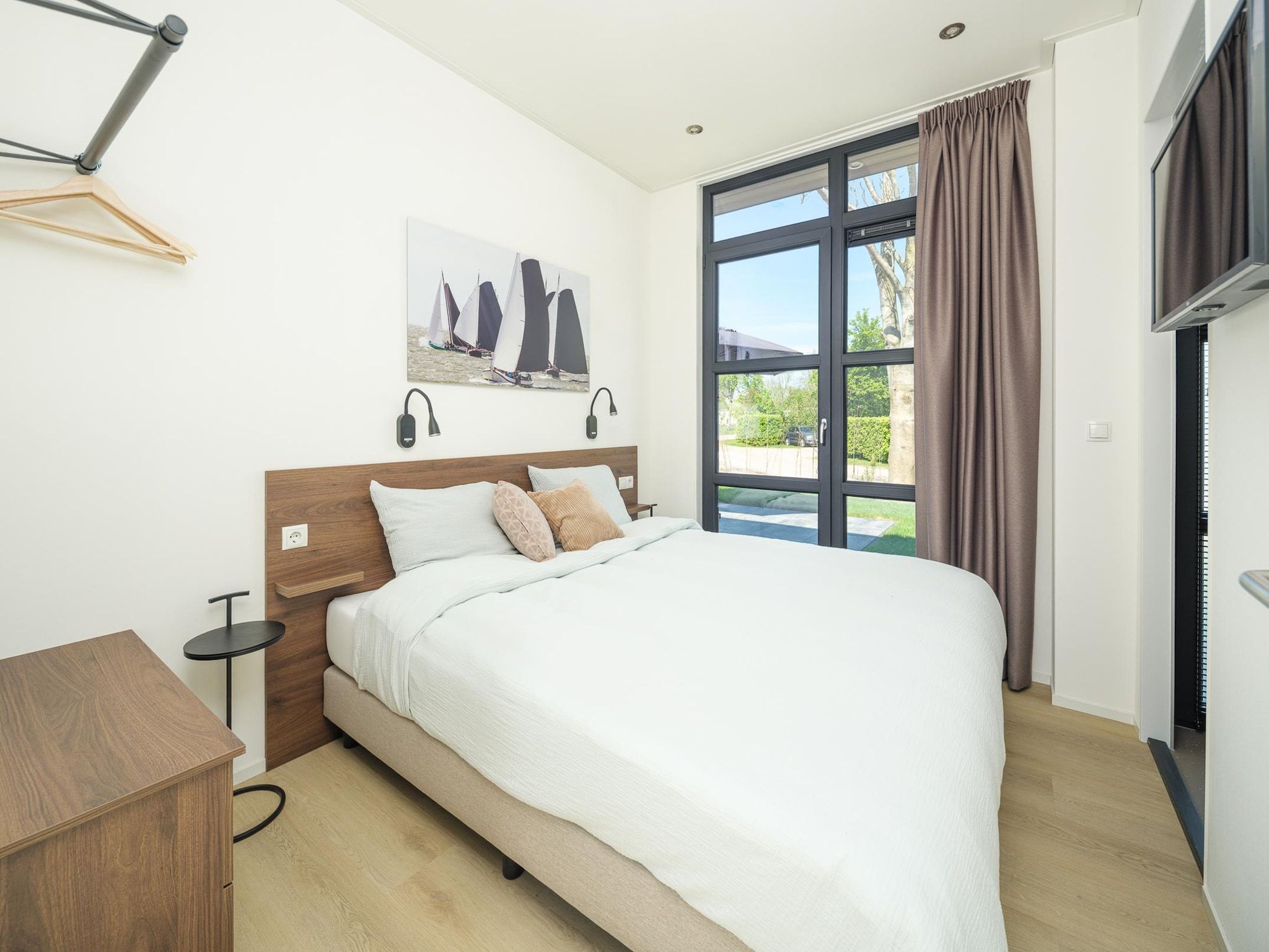 Een slaapkamer van Villa Meerzicht | 4 Pers. Sauna in Workum