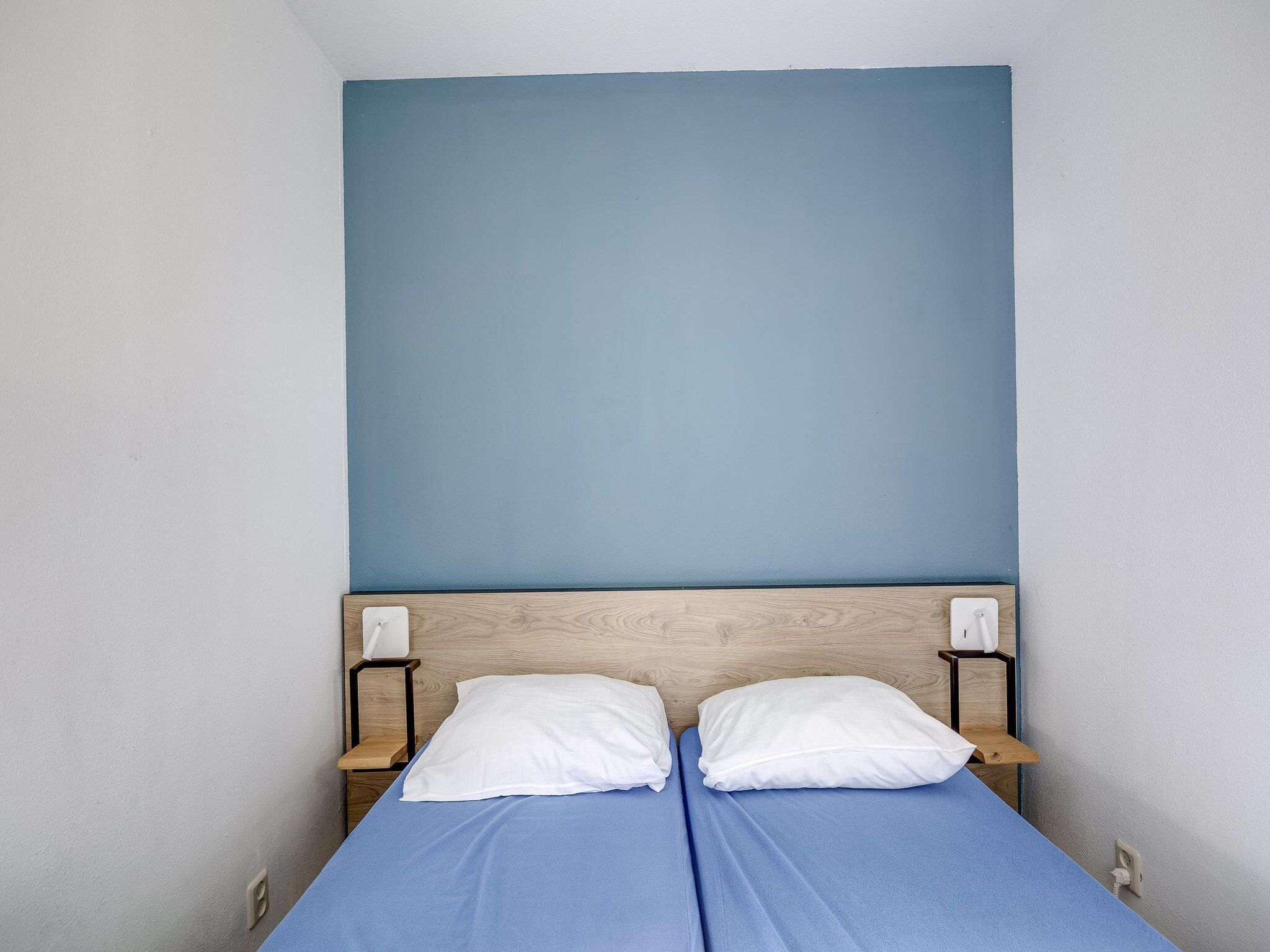 Een slaapkamer van 7 - Persoons Forest 217 Sauna Bungalow (copy) in Ewijk