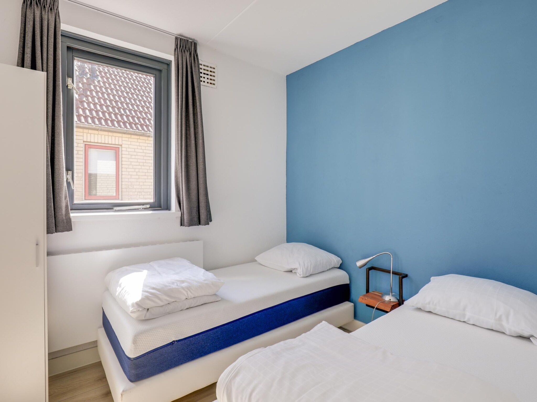 Een slaapkamer van 7 - Persoons Forest 217 Sauna Bungalow (copy) (copy) in Ewijk