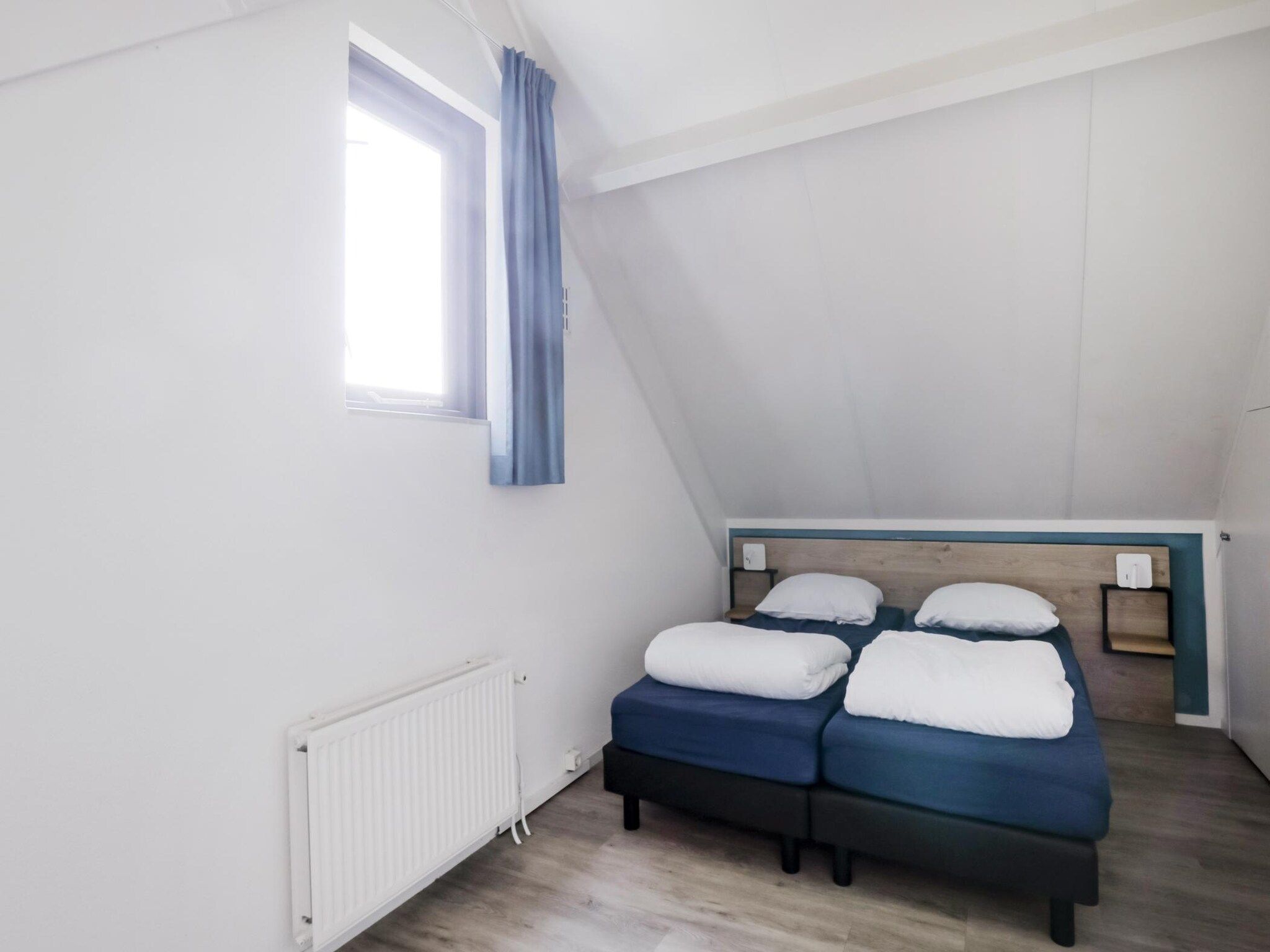 Een slaapkamer van 7 - Persoons Forest 217 Sauna Bungalow (copy) (copy) in Ewijk