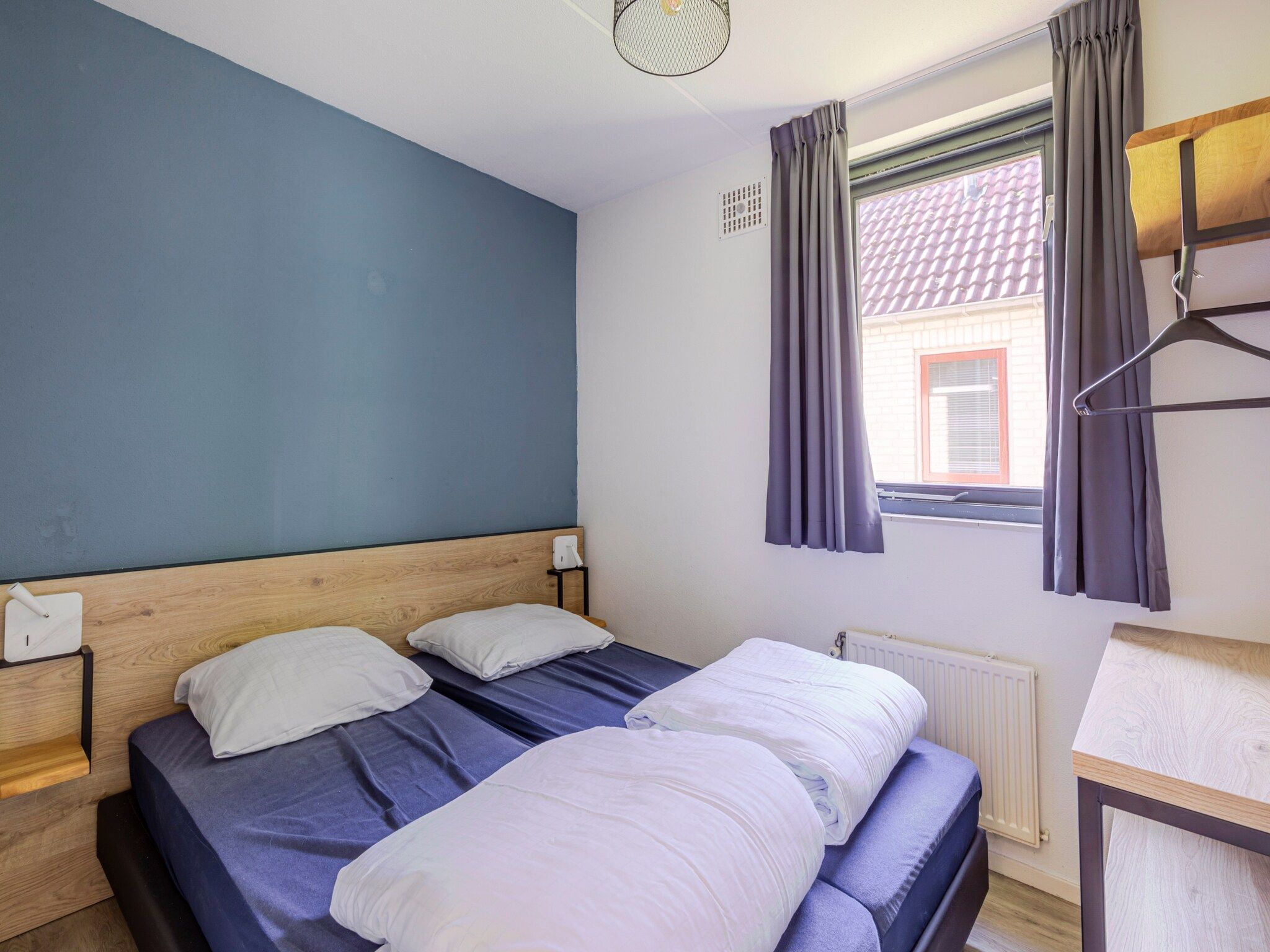 Een slaapkamer van 7 - Persoons Forest 217 Sauna Bungalow (copy) (copy) (copy) in Ewijk