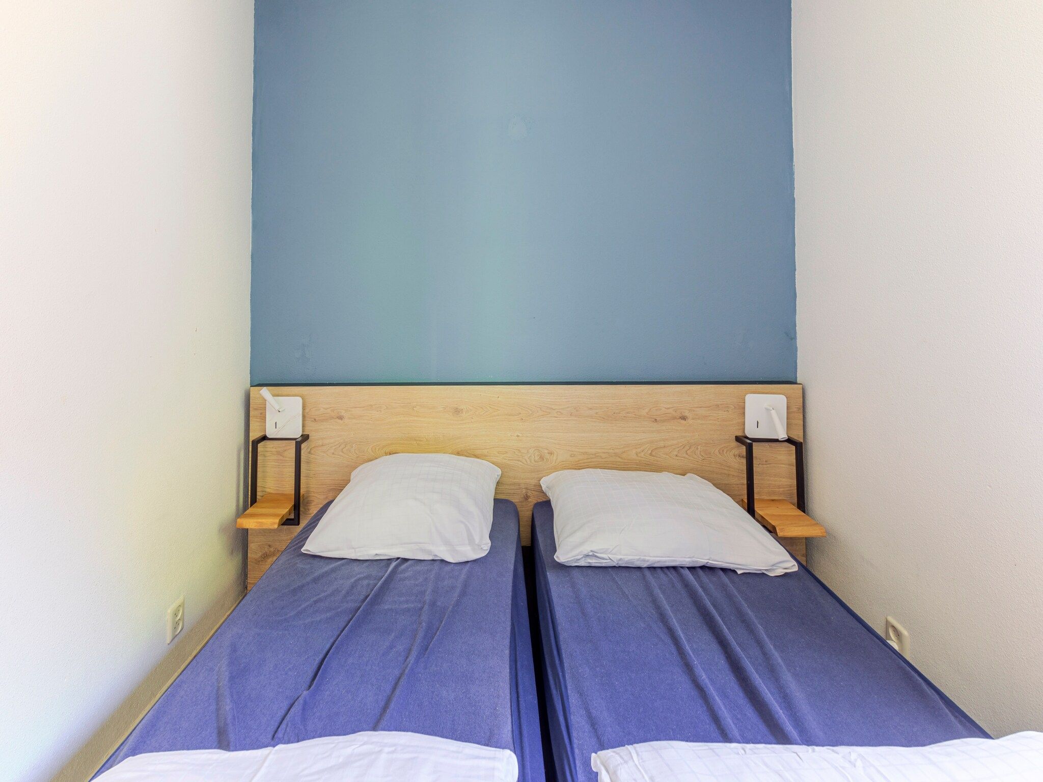 Een slaapkamer van 7 - Persoons Forest 217 Sauna Bungalow (copy) (copy) (copy) in Ewijk