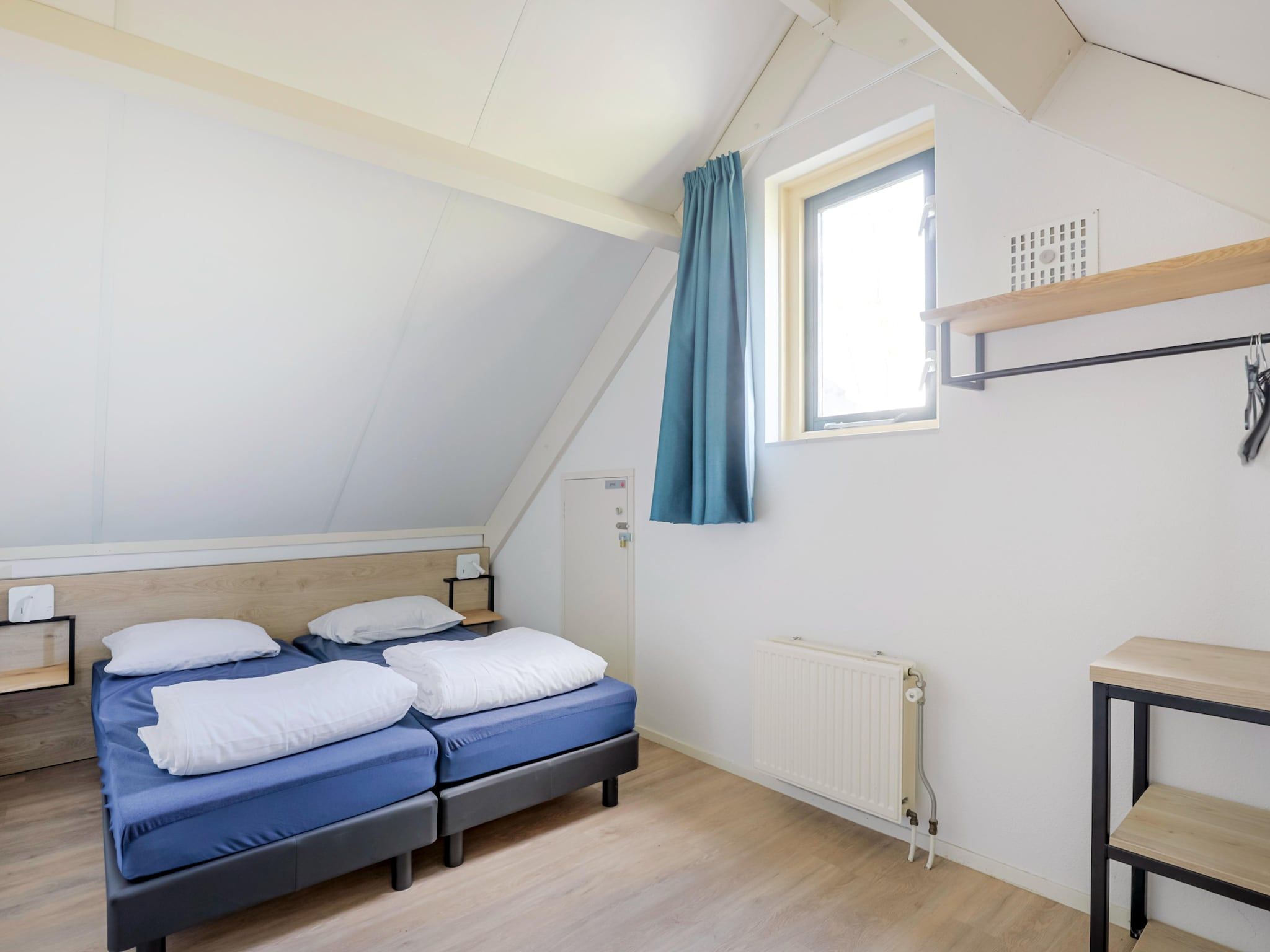 Een slaapkamer van 7 - Persoons Forest 217 Sauna Bungalow (copy) (copy) (copy) in Ewijk