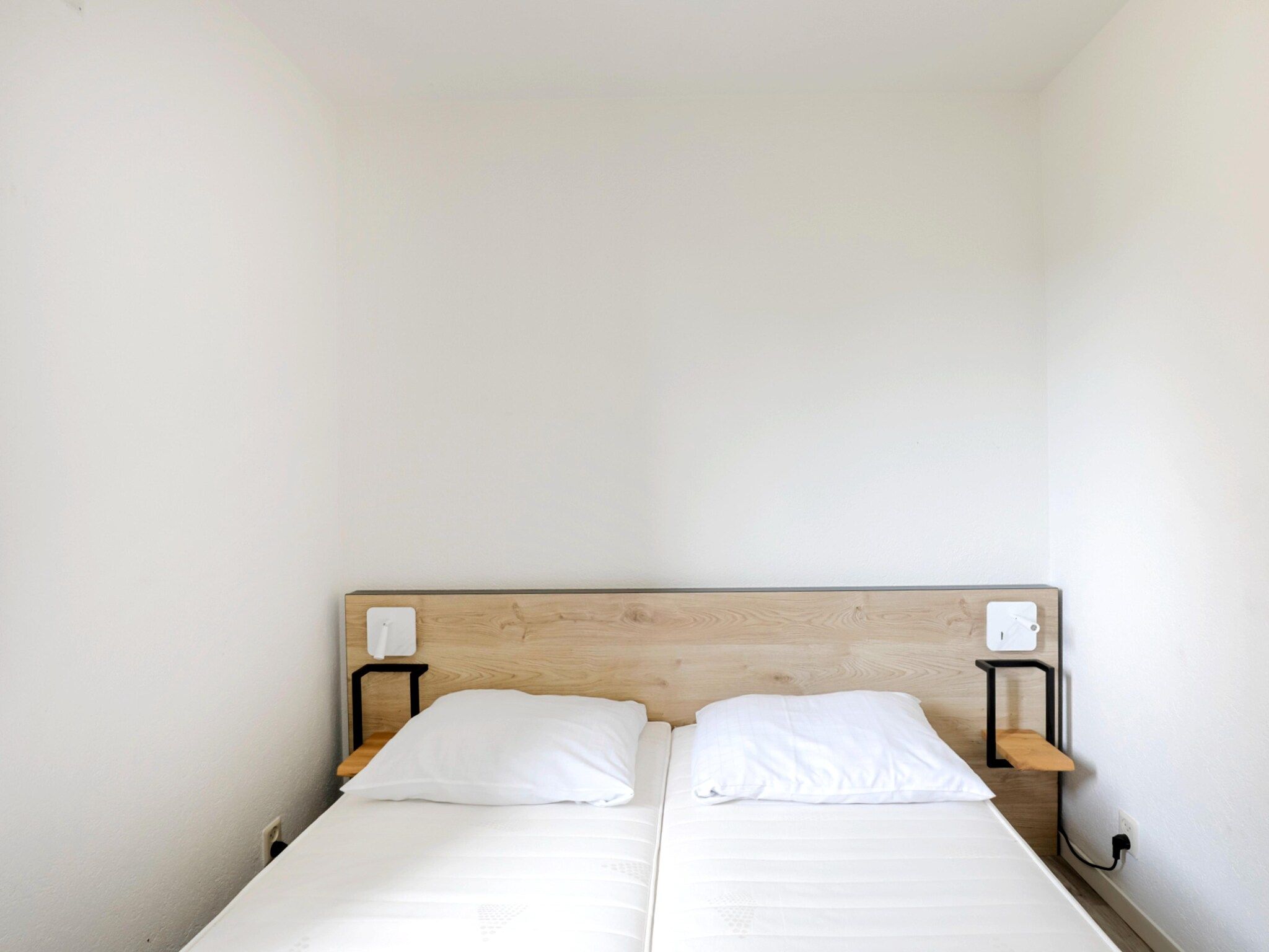 Een slaapkamer van 7 - Persoons Forest 217 Sauna Bungalow (copy) (copy) (copy) (copy) in Ewijk