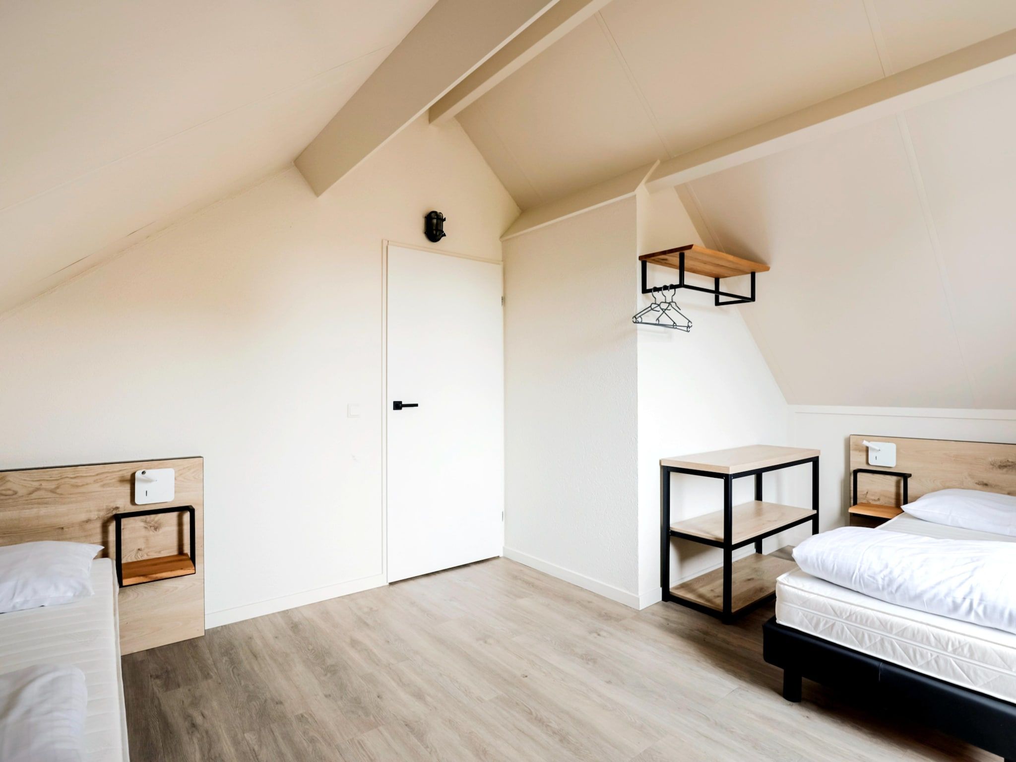 Een slaapkamer van 7 - Persoons Forest 217 Sauna Bungalow (copy) (copy) (copy) (copy) in Ewijk