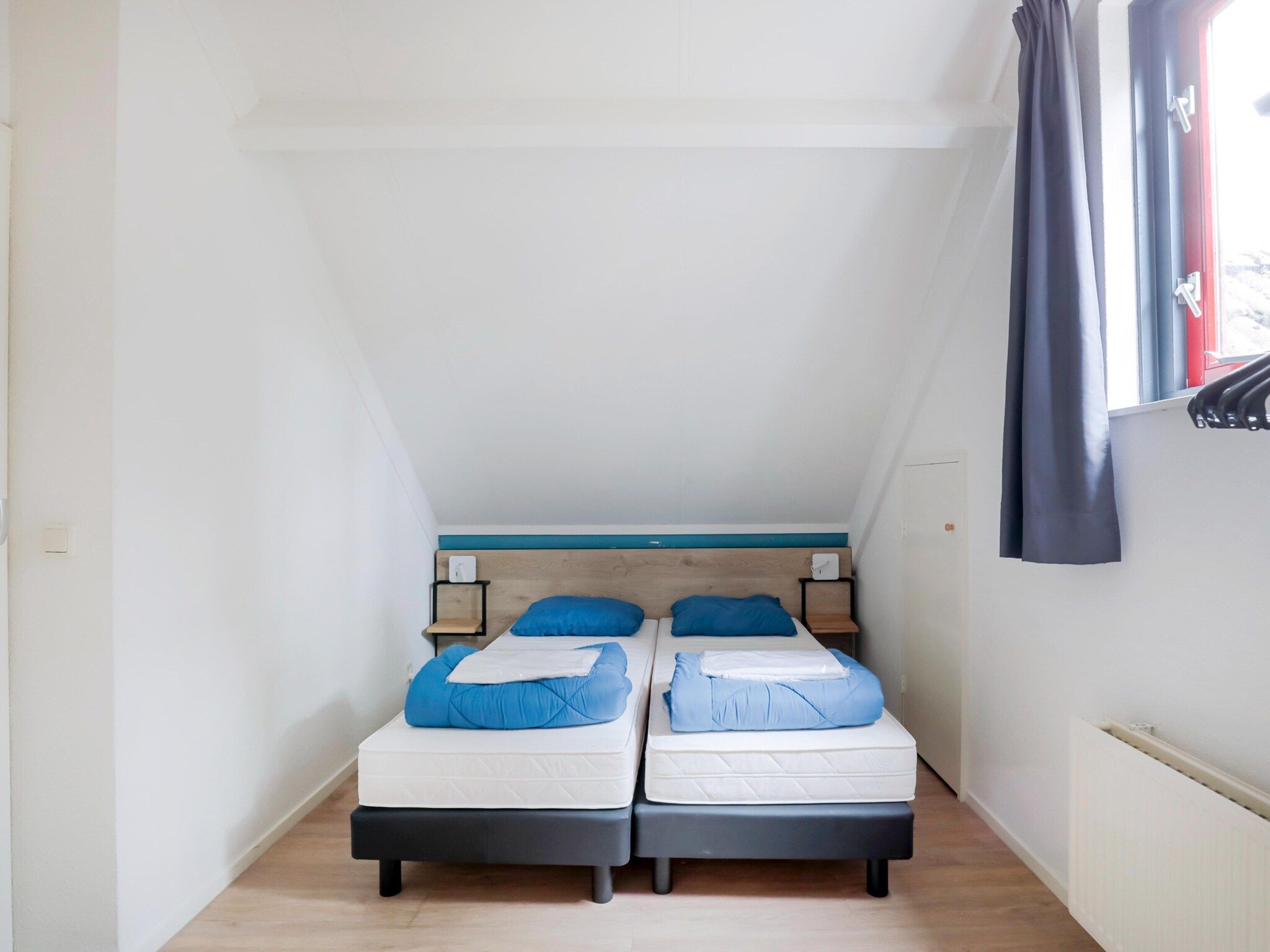 Een slaapkamer van 7 - Persoons Forest 217 Sauna Bungalow (copy) (copy) (copy) in Ewijk