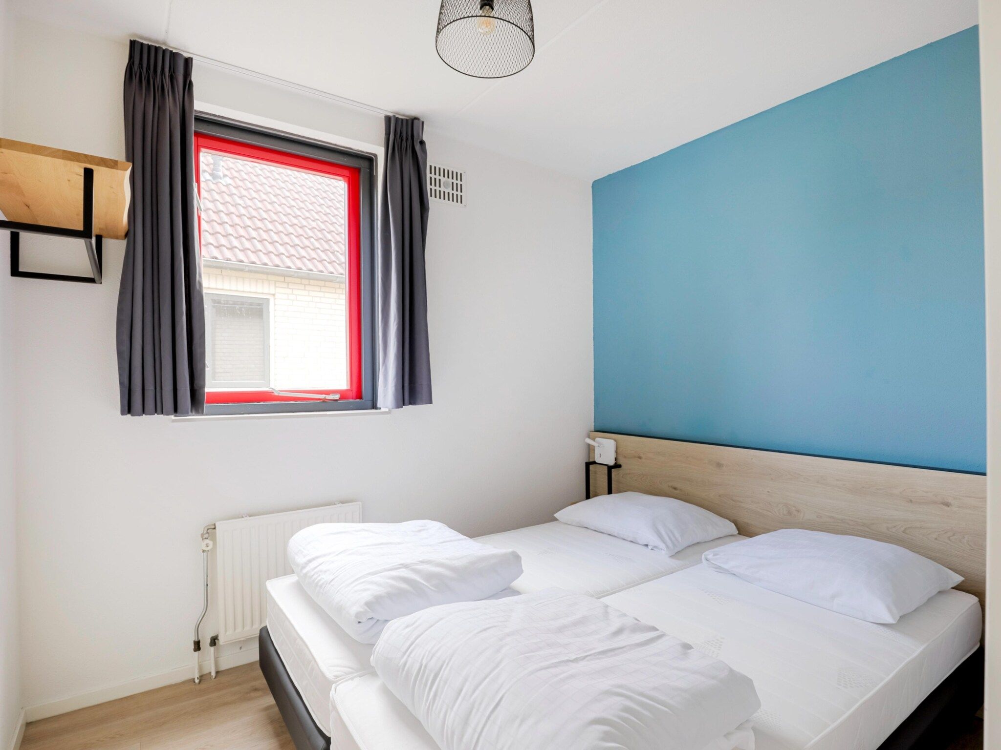 Een slaapkamer van 7 - Persoons Forest 217 Sauna Bungalow (copy) (copy) (copy) in Ewijk