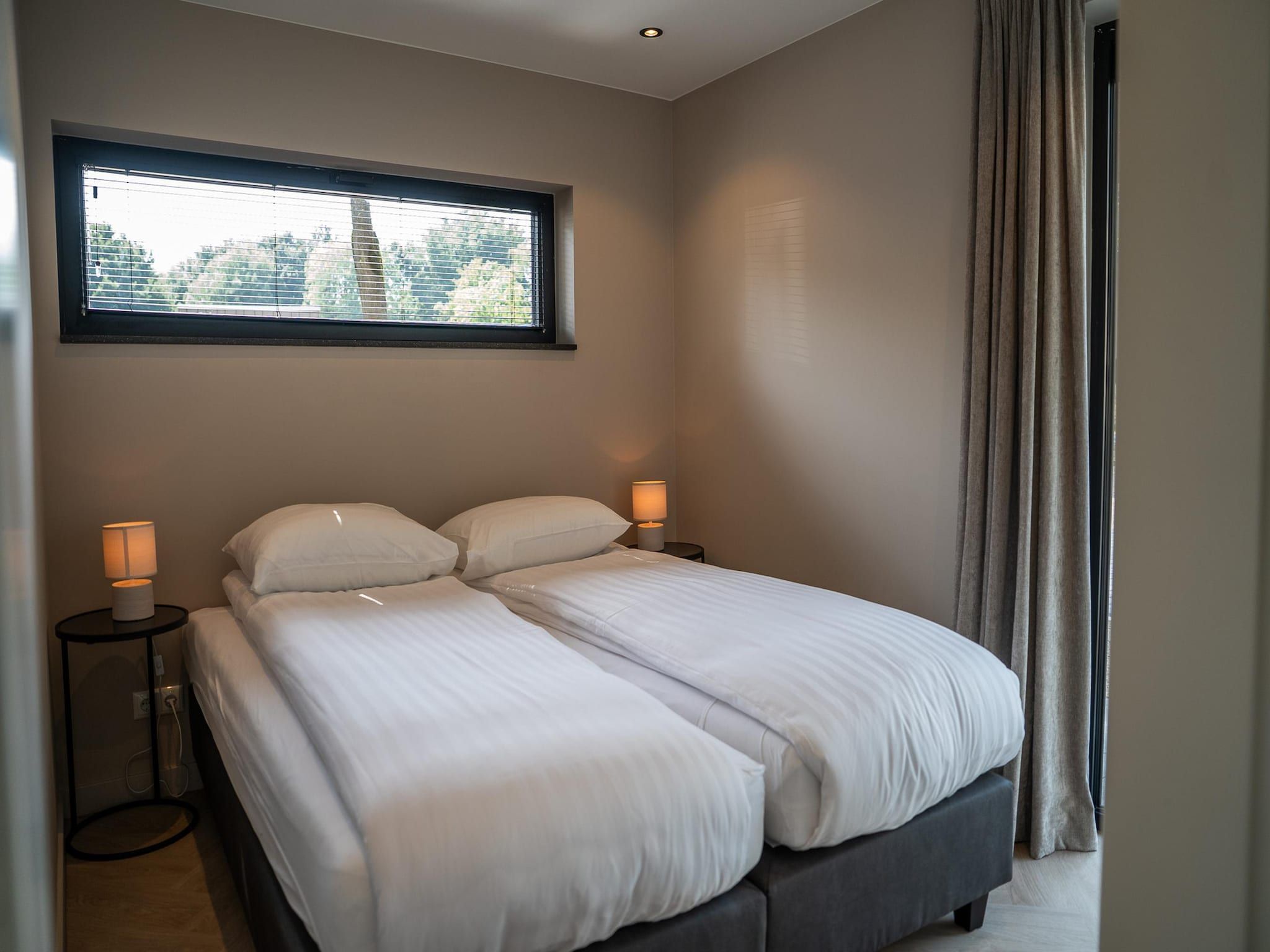 Een slaapkamer van Ecovilla Waterzicht  6 people Luxe in Oirschot