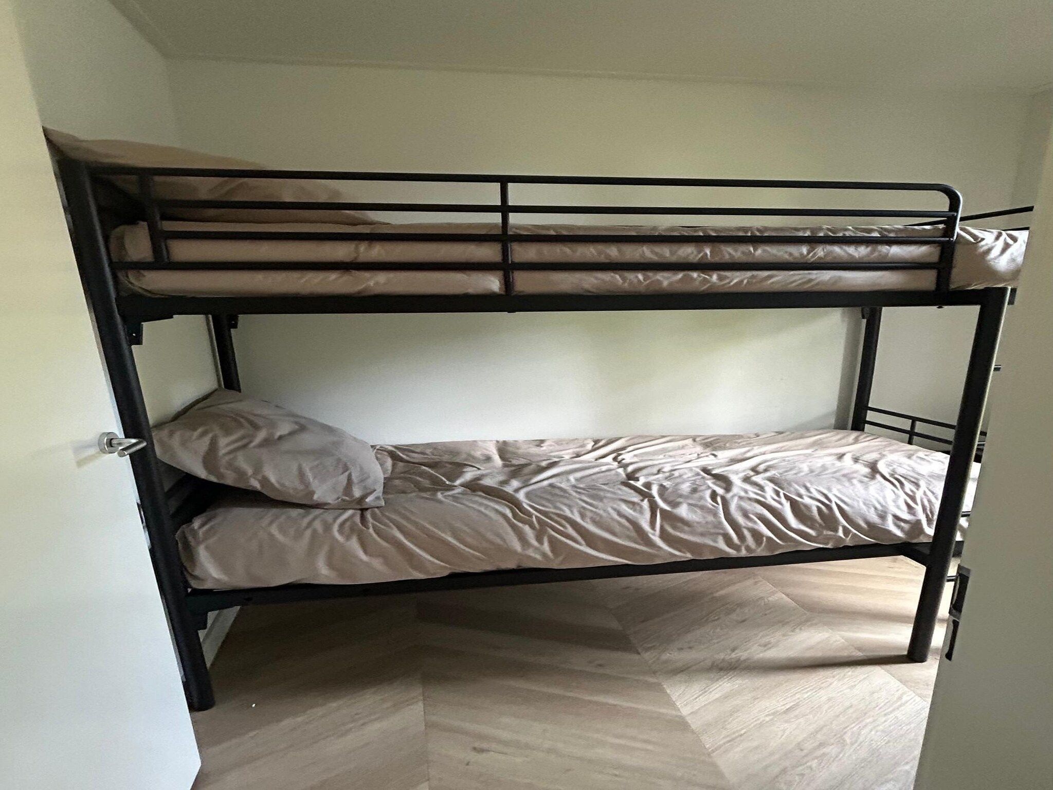 Een slaapkamer van De Steppe 8 pax - 8 in Ulicoten