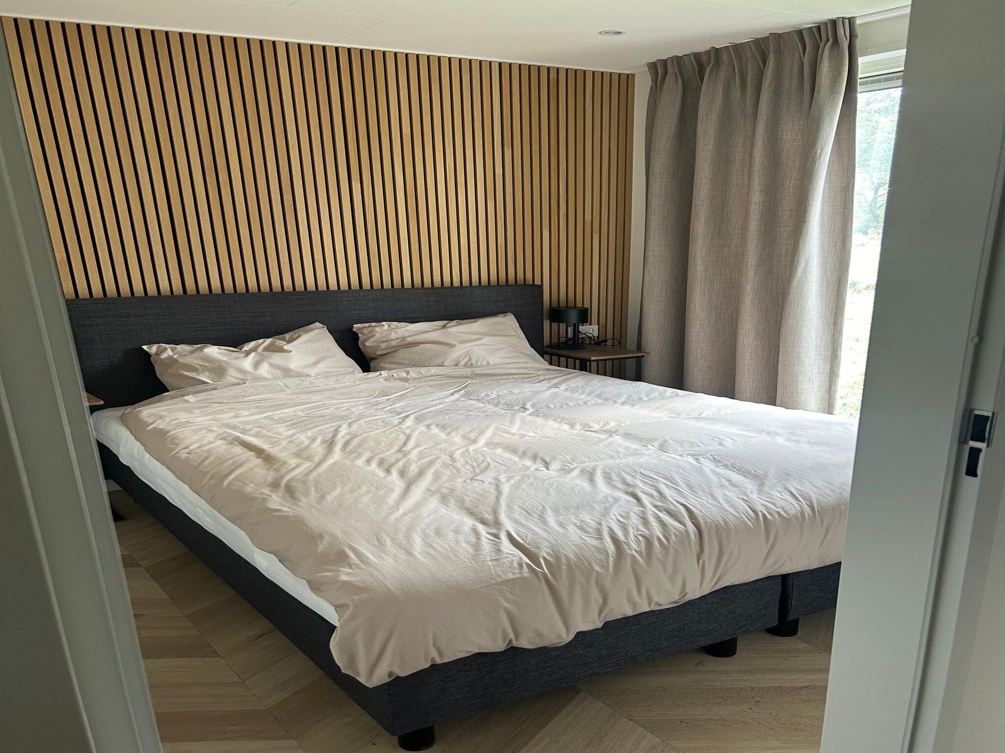 Een slaapkamer van De Steppe 8 pax - 9 in Ulicoten