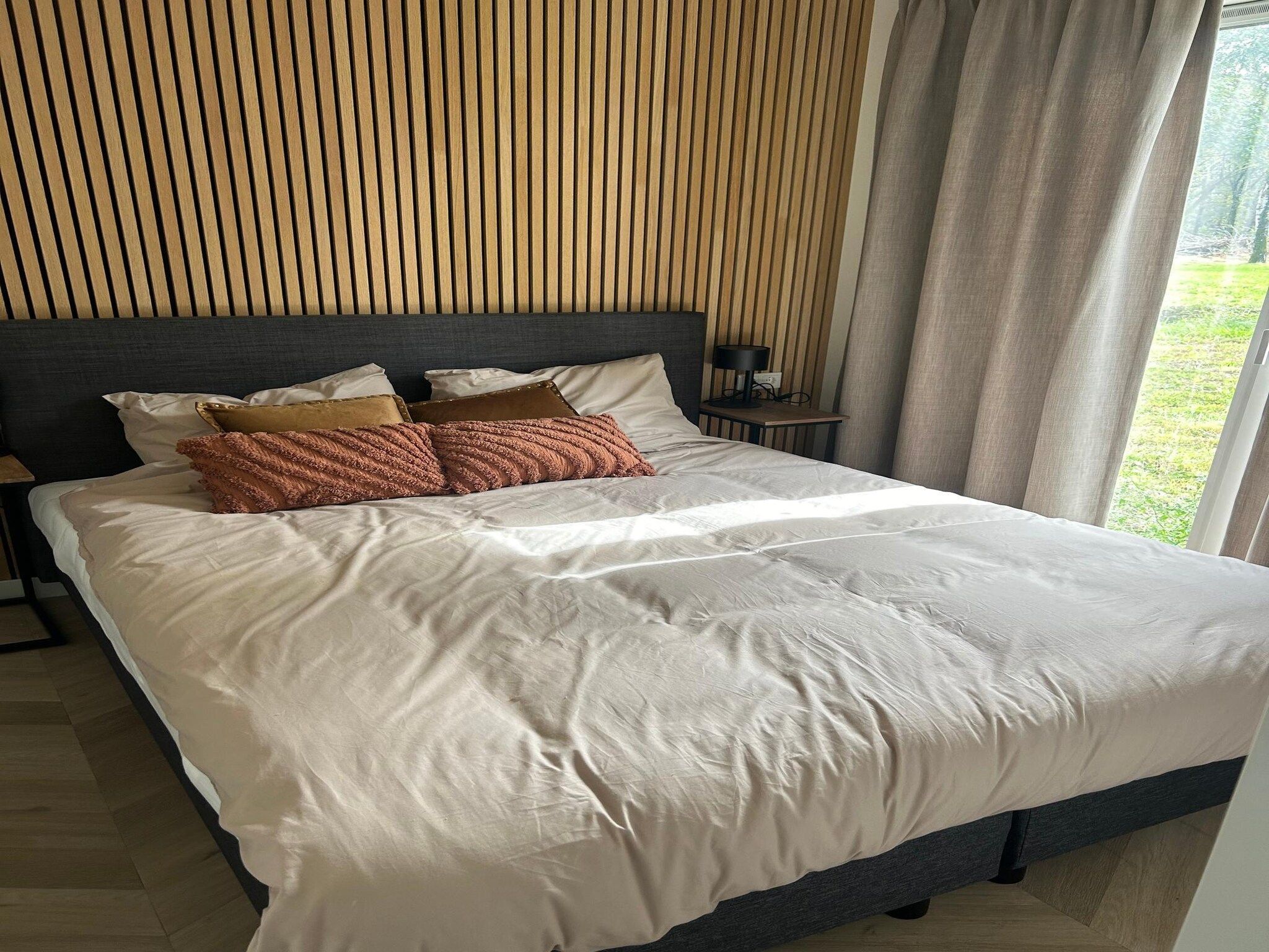 Een slaapkamer van De Steppe 8 pax - 11 in Ulicoten