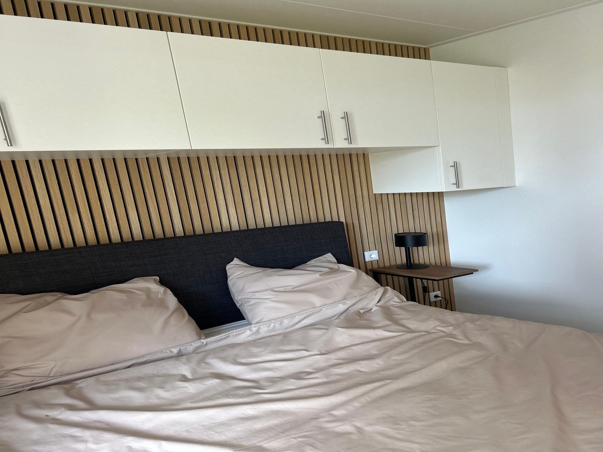 Een slaapkamer van De Steppe 8 pax - 12 in Ulicoten