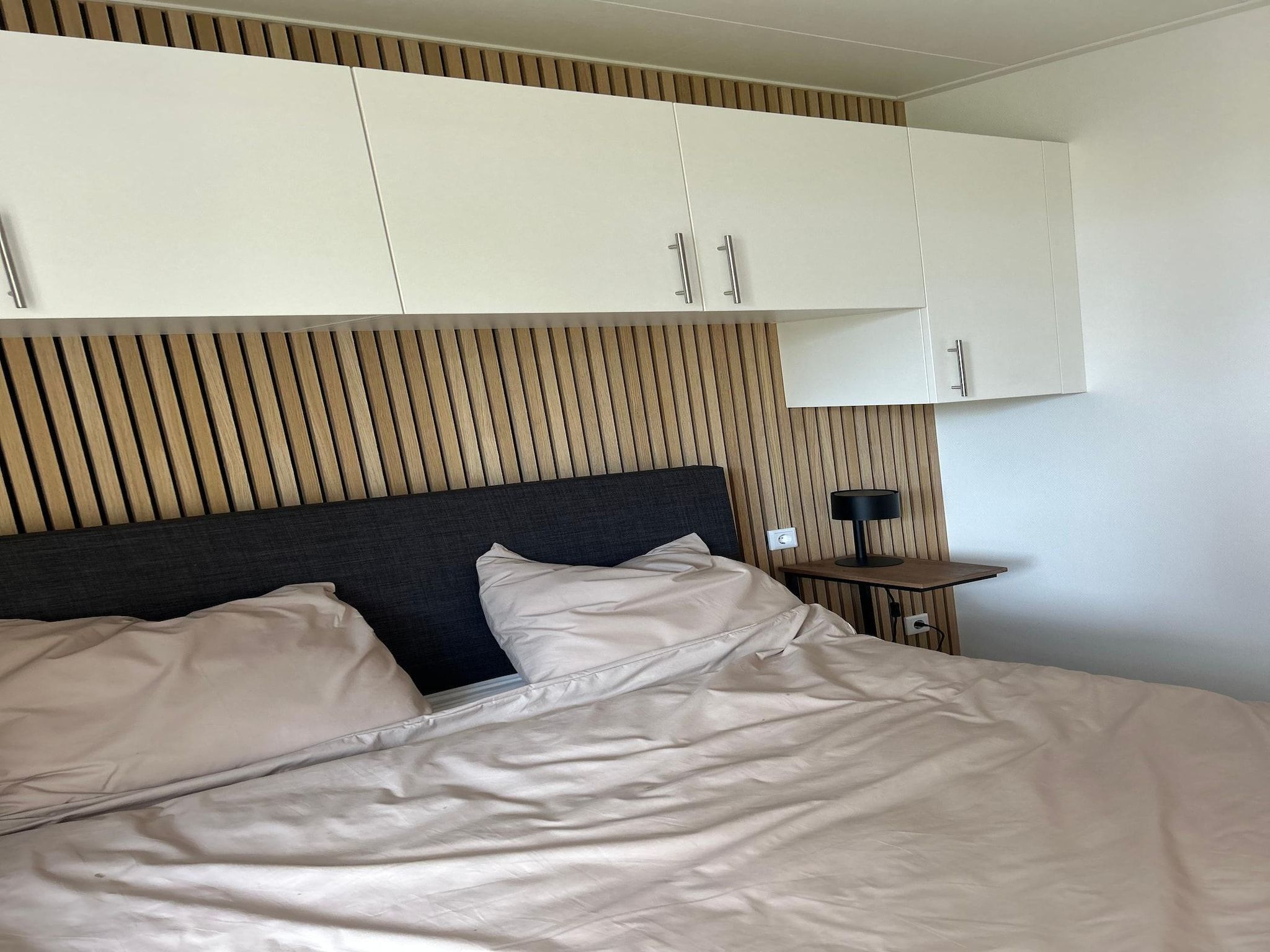 Een slaapkamer van De Steppe 8 pax - 13 in Ulicoten