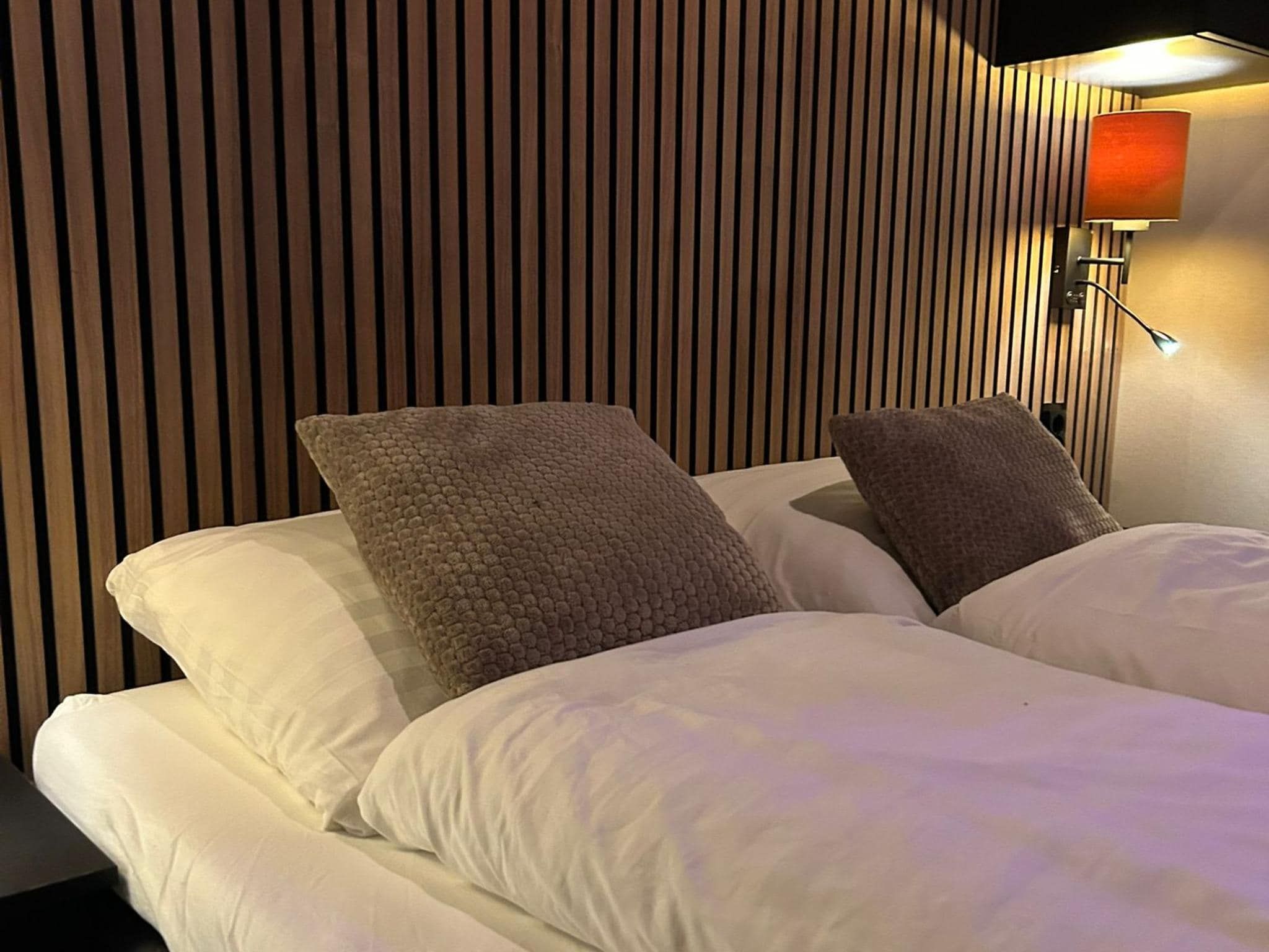 Een slaapkamer van Wellnesslodge Specht 2p in Dalerveen