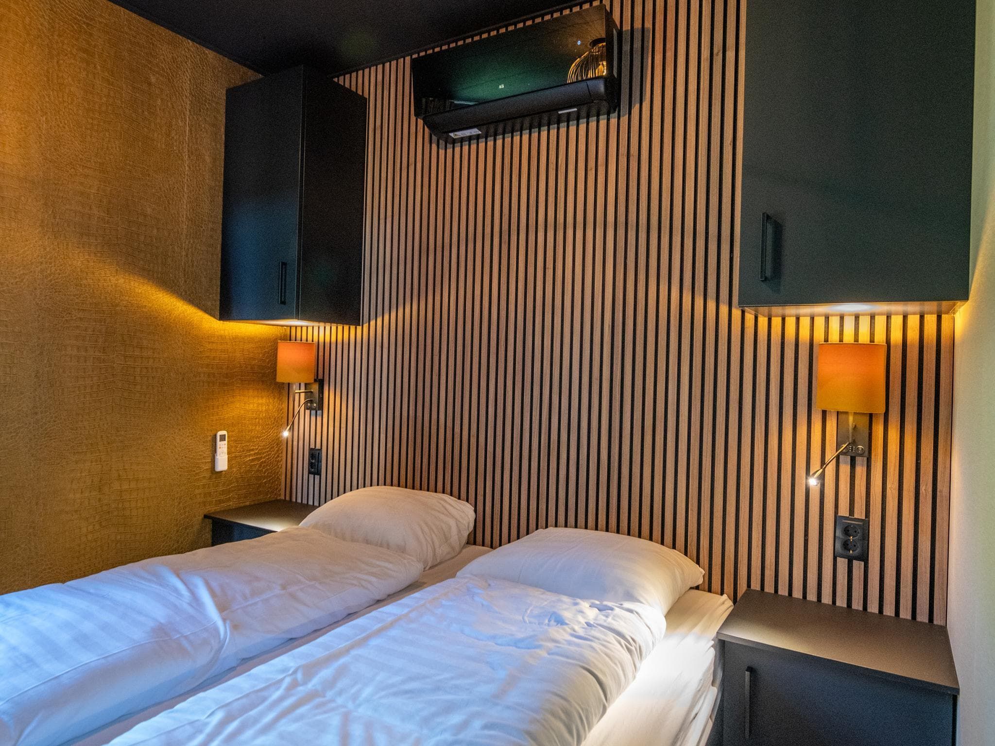 Een slaapkamer van Wellnesslodge Specht 2p in Dalerveen