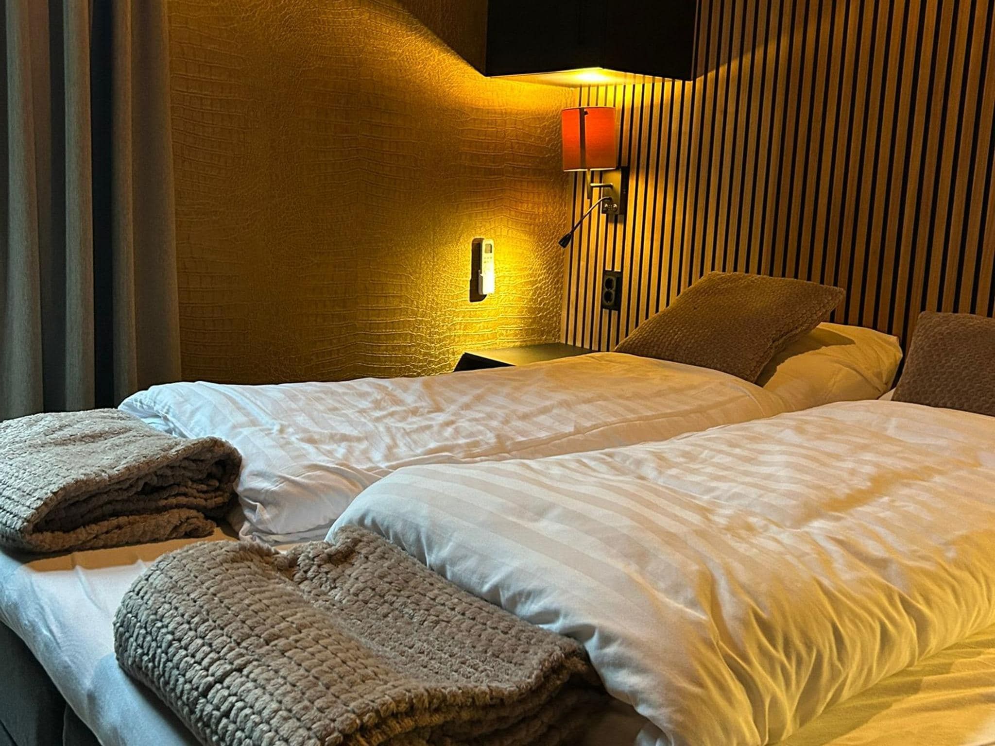 Een slaapkamer van Wellnesslodge Merel 2p in Dalerveen