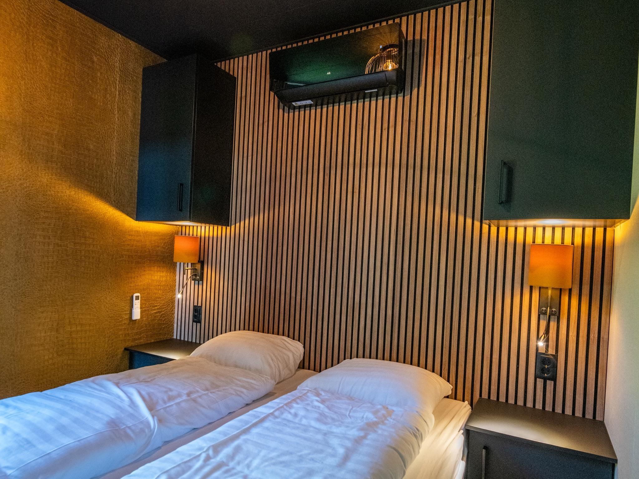 Een slaapkamer van Wellnesslodge Merel 2p in Dalerveen